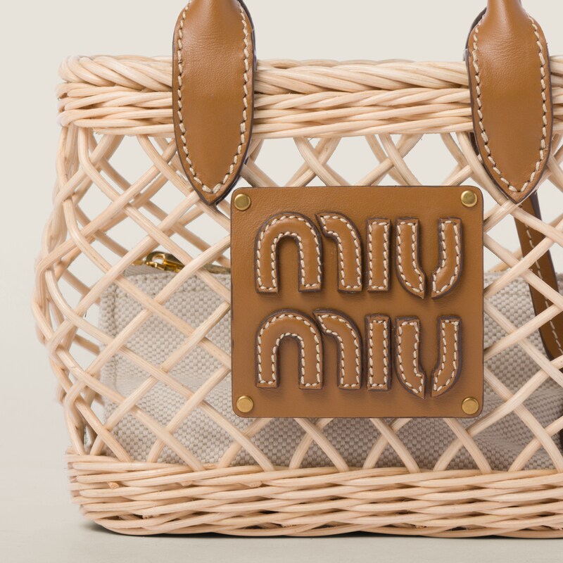 Bolsa em tecido com acabamento em couro