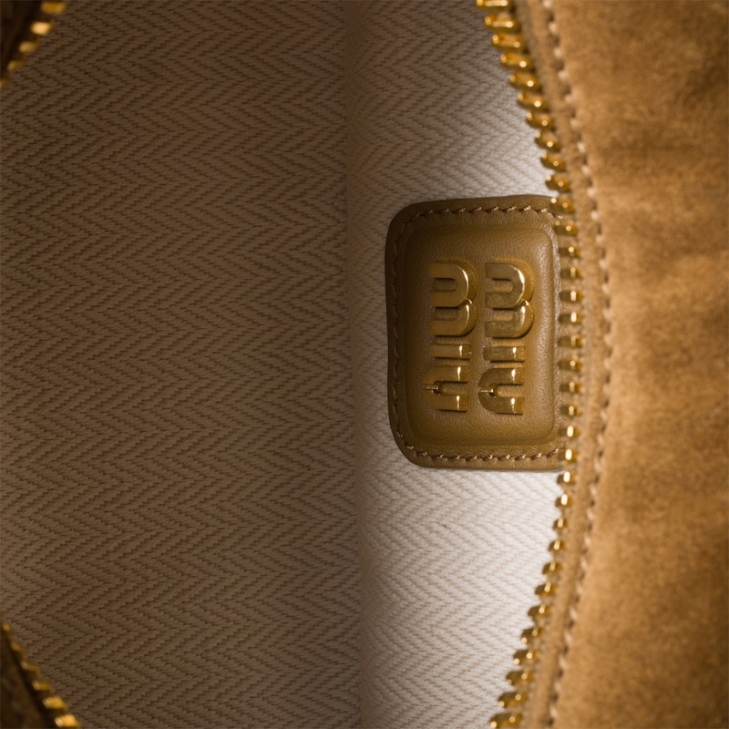 Arcadie padded suede top-handle bag