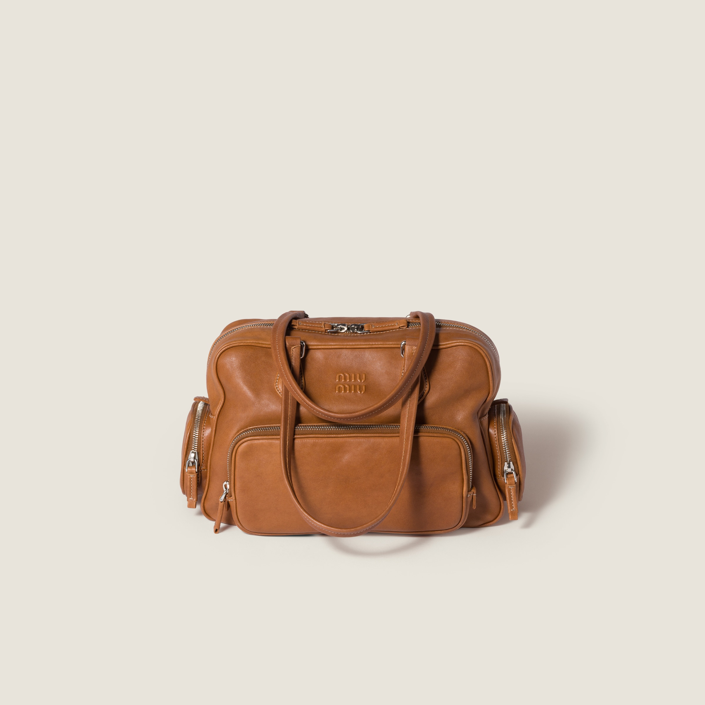 Miu Miu Pocket Nappa Leather Top-handle Bag In Brown