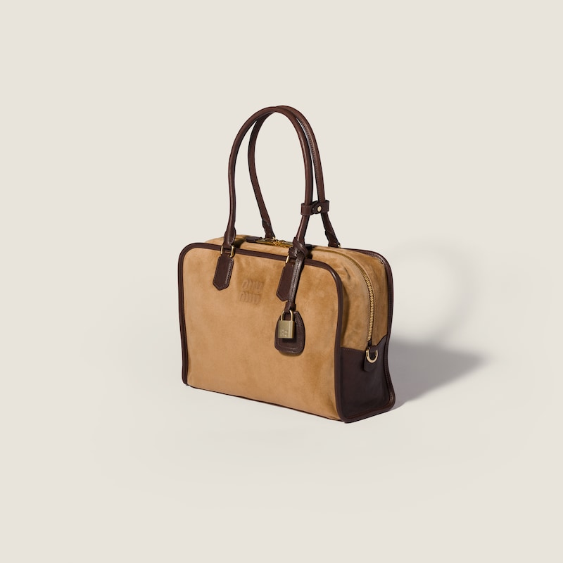 Retour Tasche aus Veloursleder