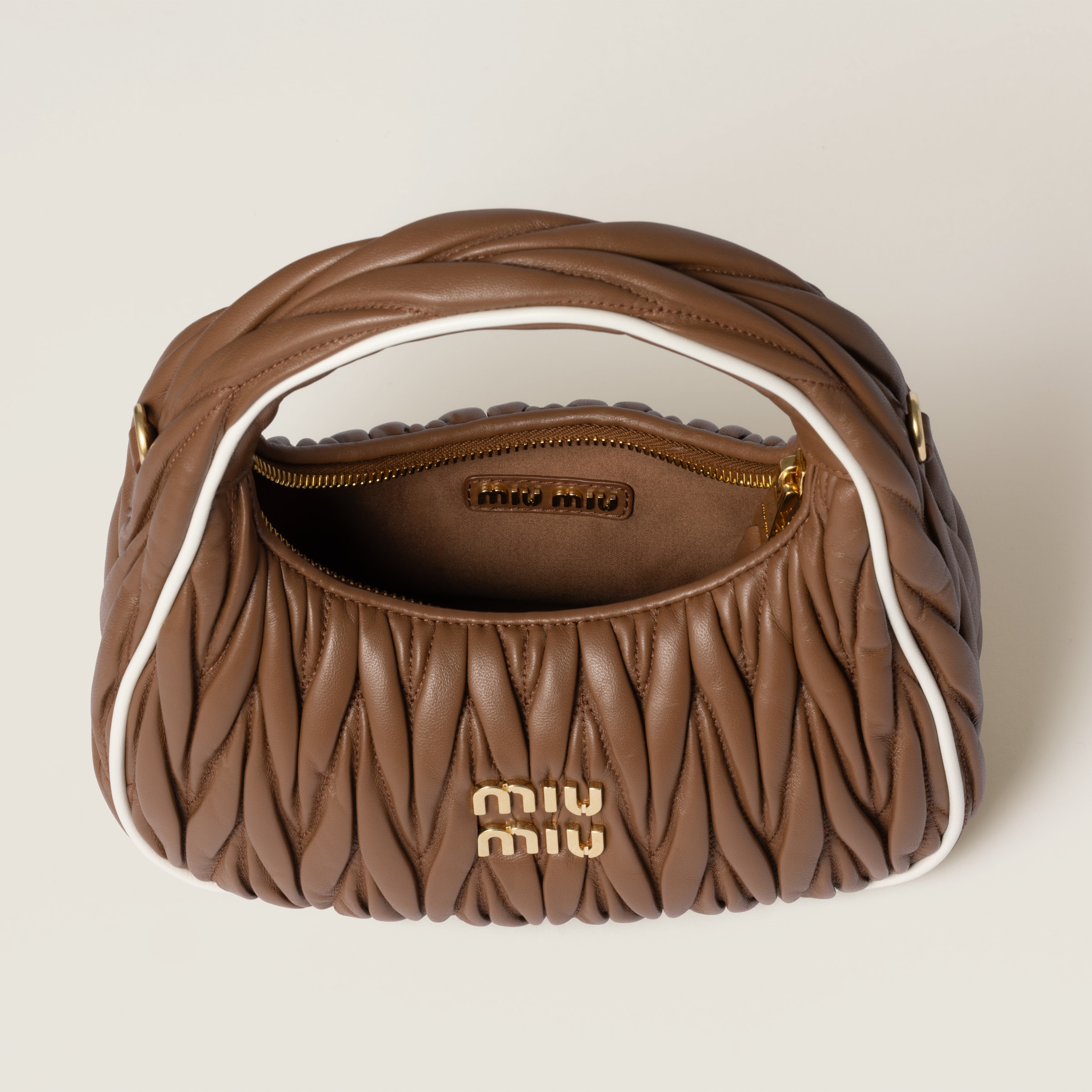 Miu Miu Wander Matelassé Nappa Leather Bag In Cognac/white