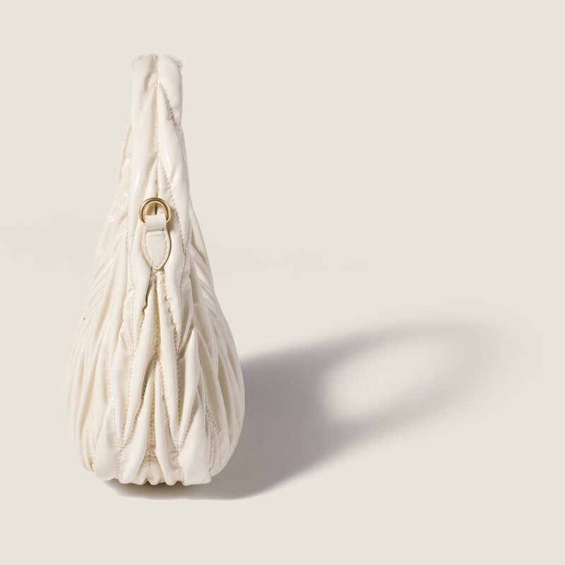 Wander matelassé patent leather bag