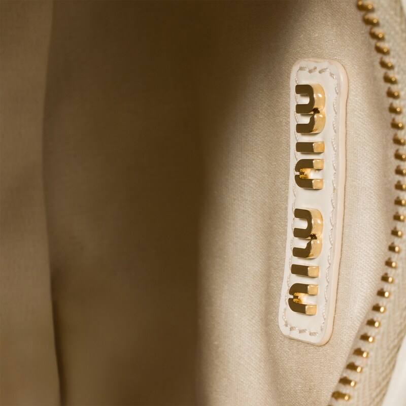 Wander matelassé patent leather bag