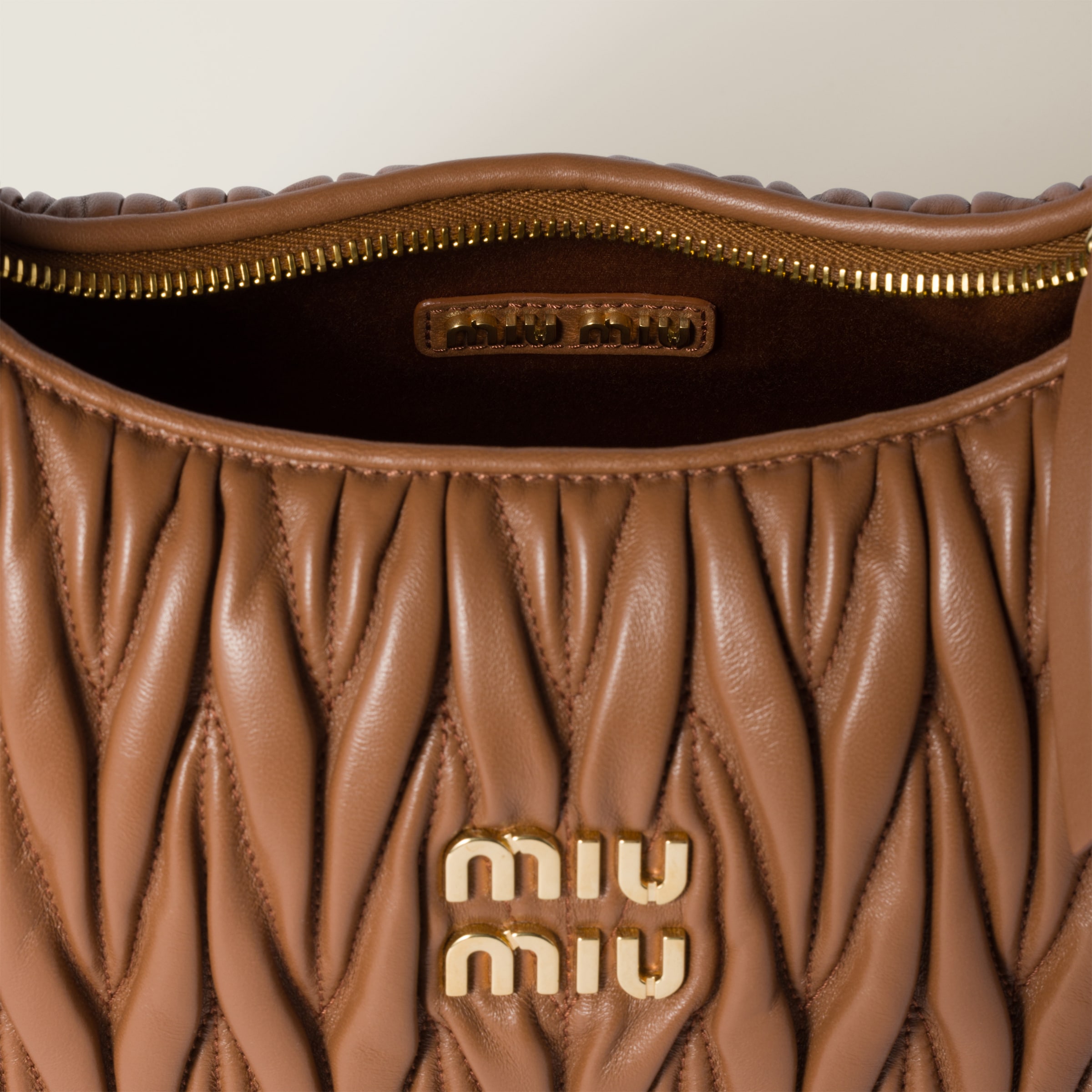 Shop Miumiu Wander Matelassé Nappa Leather Hobo Bag In Cognac