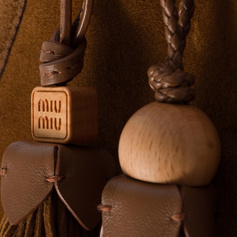 Suede handbag with tassels