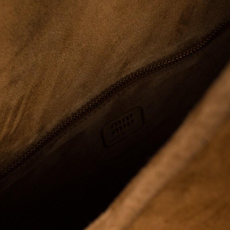 Suede handbag with tassels