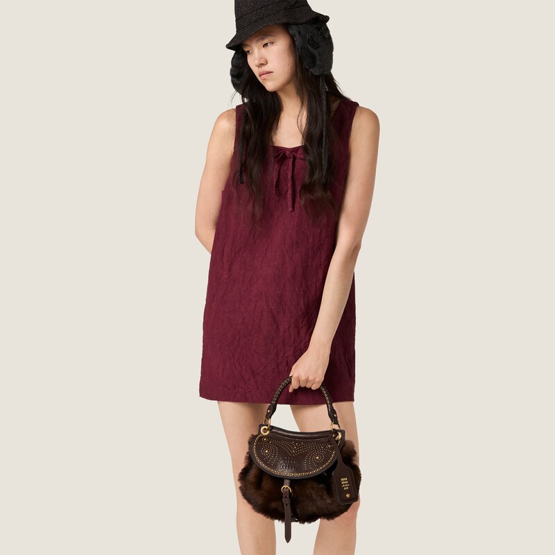 Sac Rendez-vous en shearling et cuir nappa orné de clous en métal
