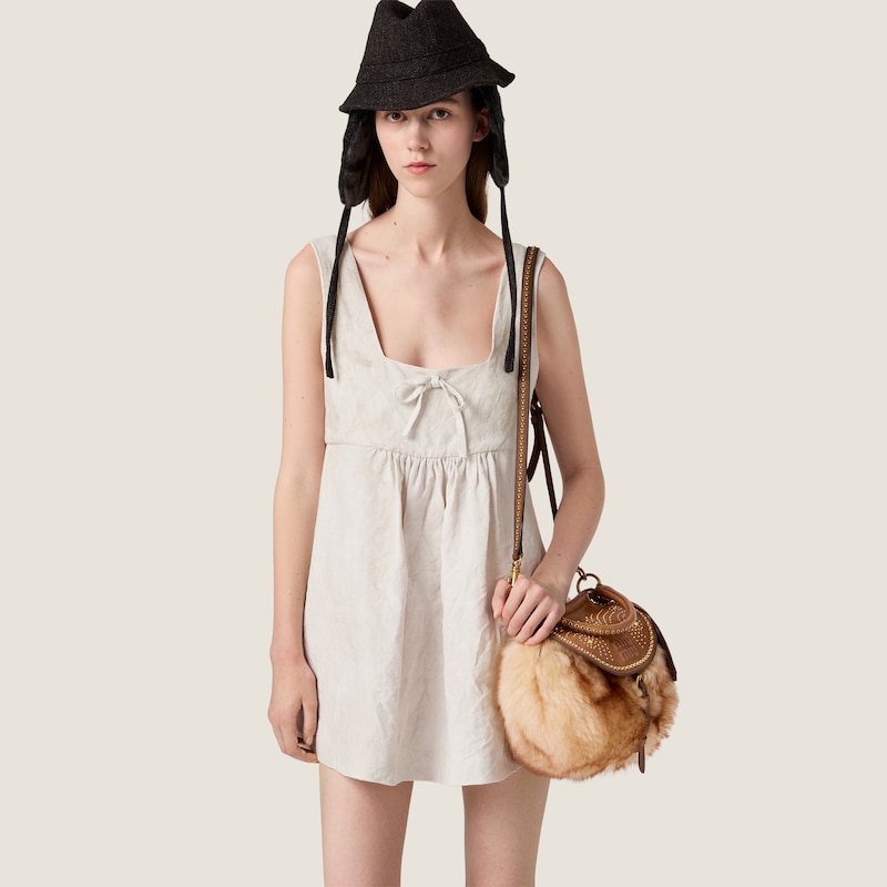 Sac Rendez-vous en shearling et cuir nappa orné de clous en métal