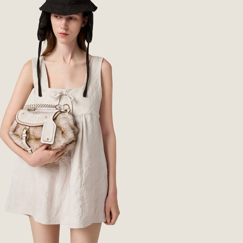 Sac Rendez-vous en shearling et cuir nappa orné de clous en métal