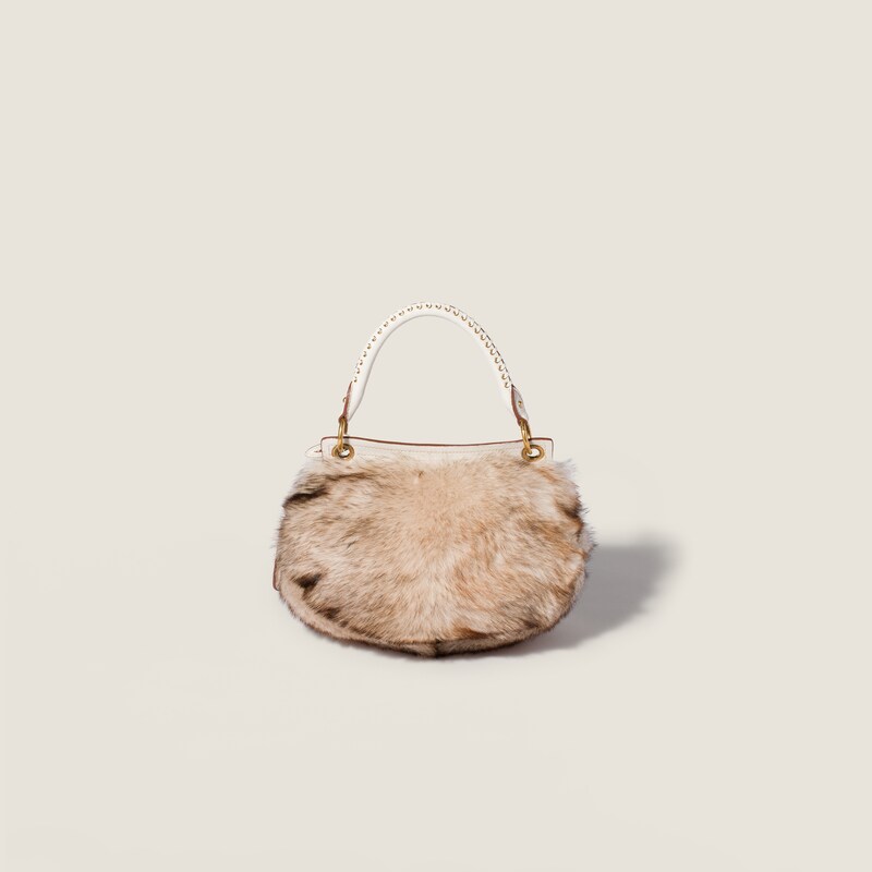 Sac Rendez-vous en shearling et cuir nappa orné de clous en métal