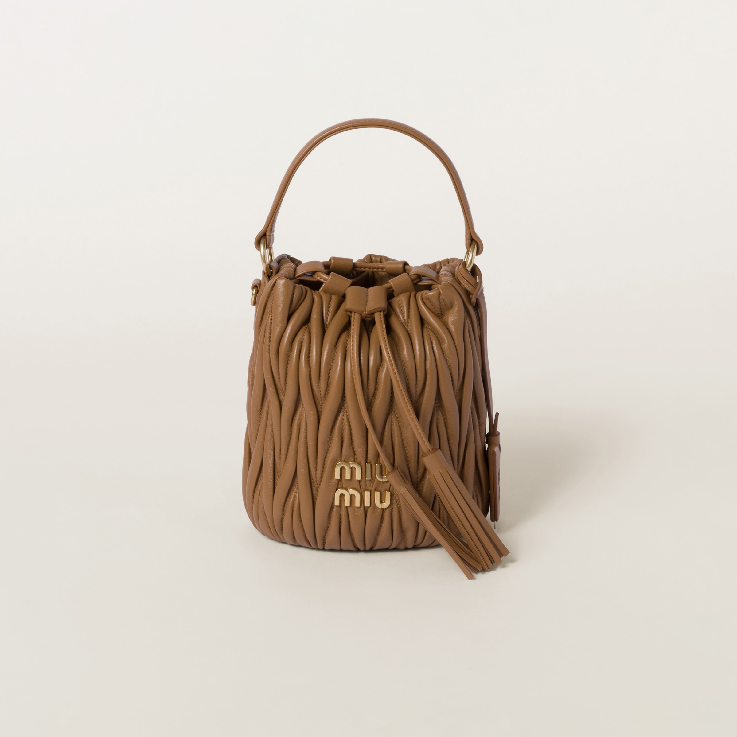 Miumiu Matelassé Nappa Leather Bucket Bag In Caramel