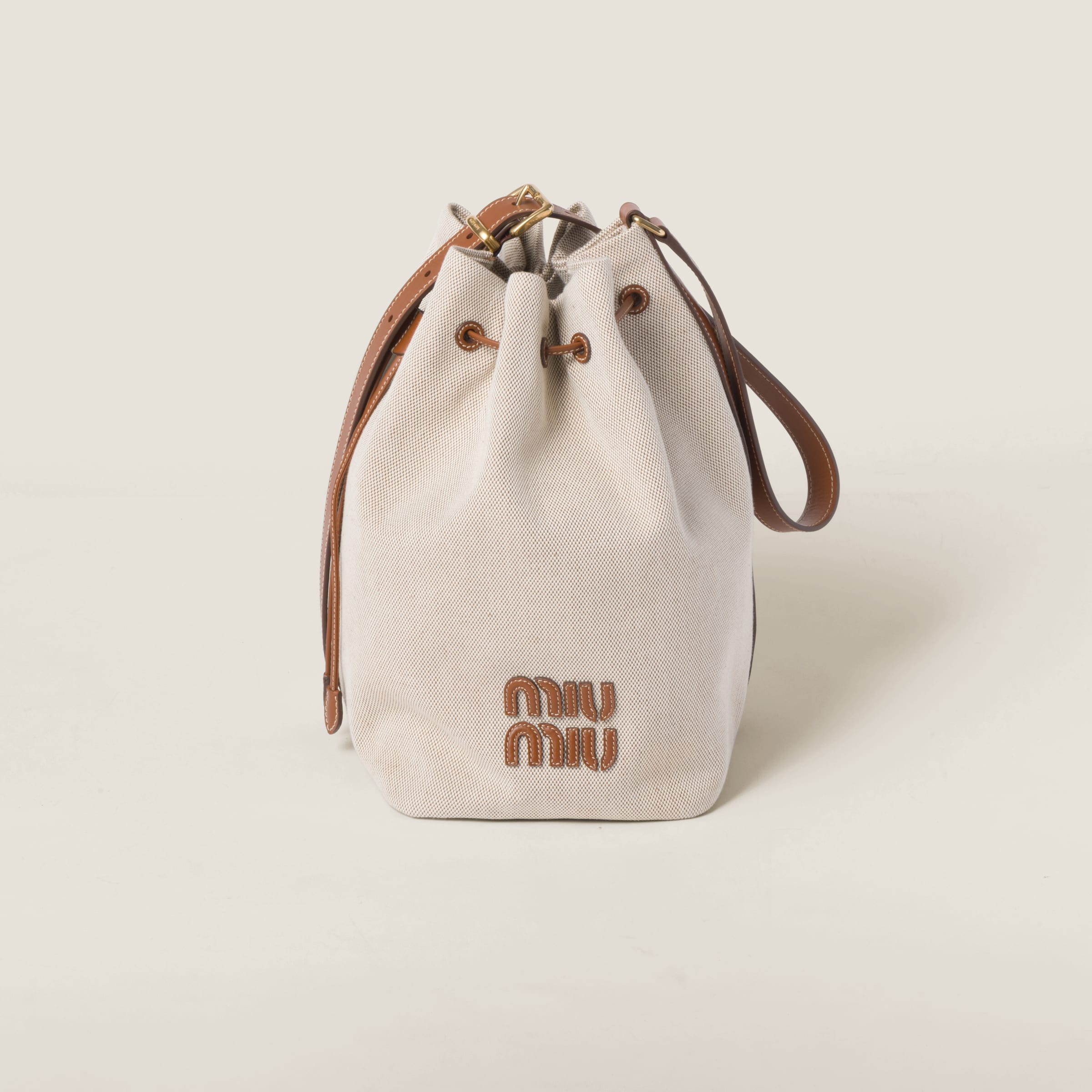 Miumiu Canvas And Leather Bucket Bag In Beige/brandy