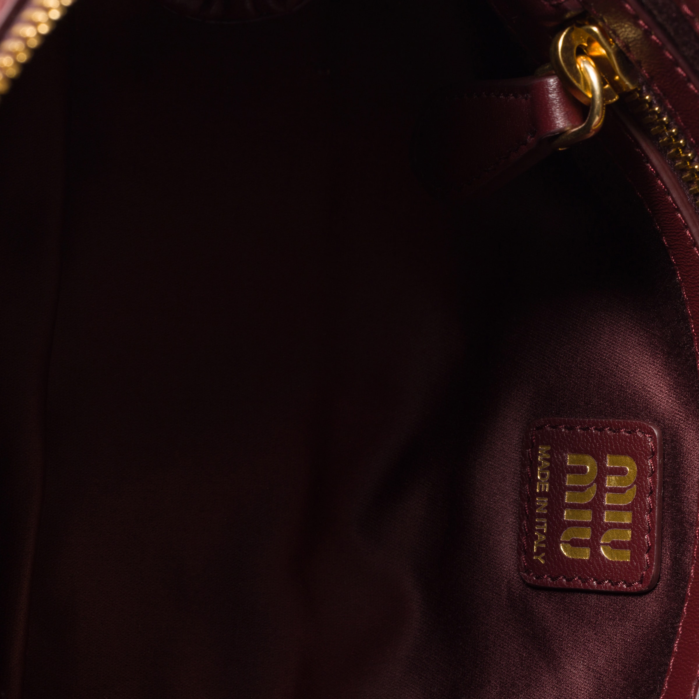 Miu Miu Matelassé Nappa Leather Clutch In Burgundy
