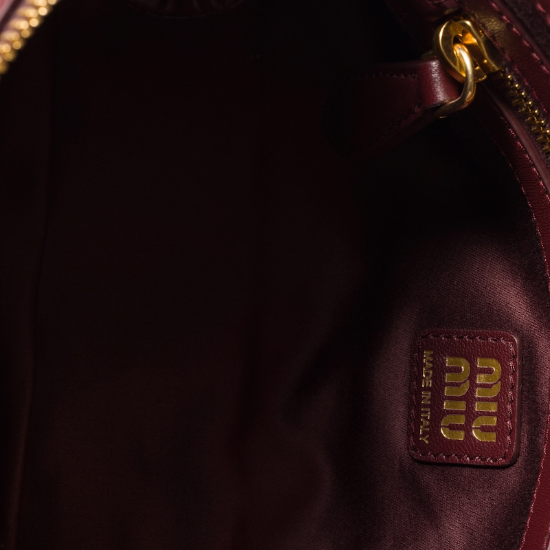 Matelassé nappa leather clutch