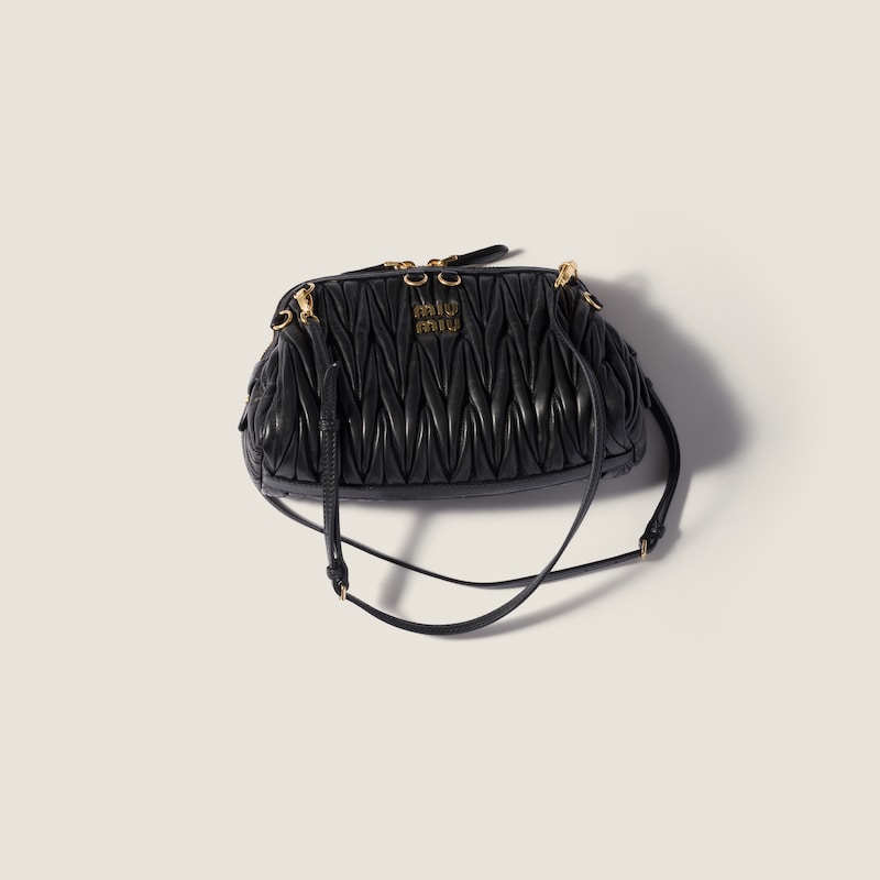 Caprice matelassé nappa leather clutch