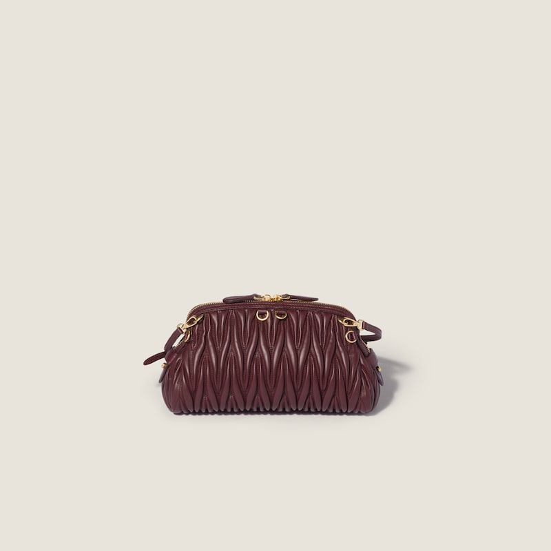 Caprice matelassé nappa leather clutch
