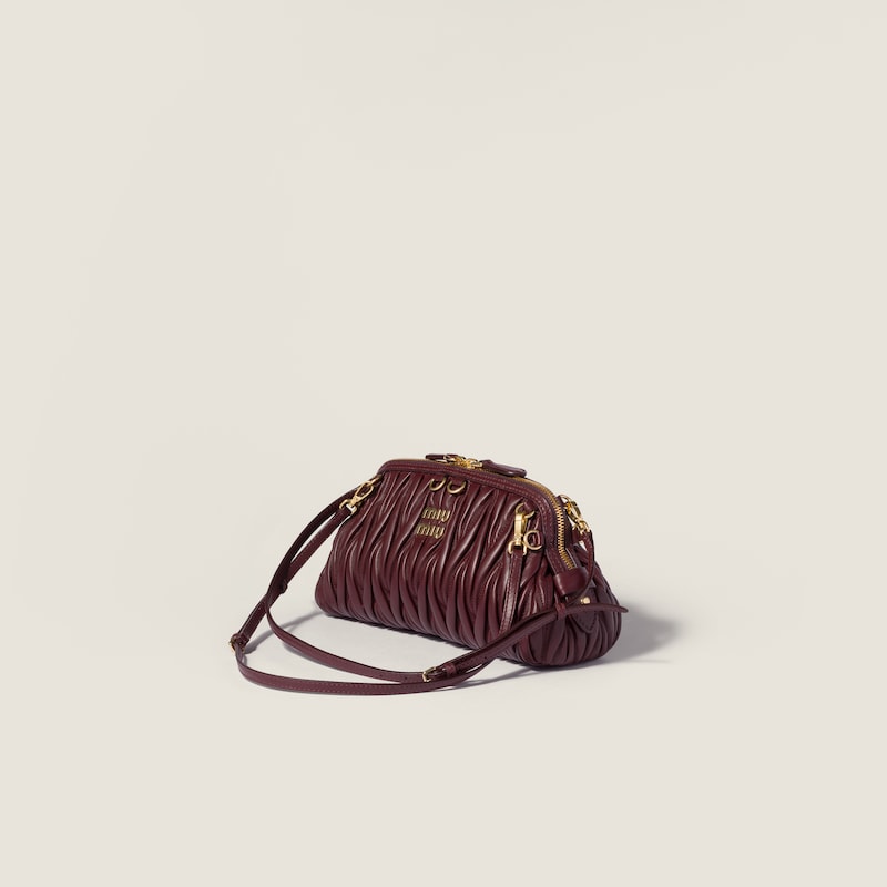 Caprice matelassé nappa leather clutch