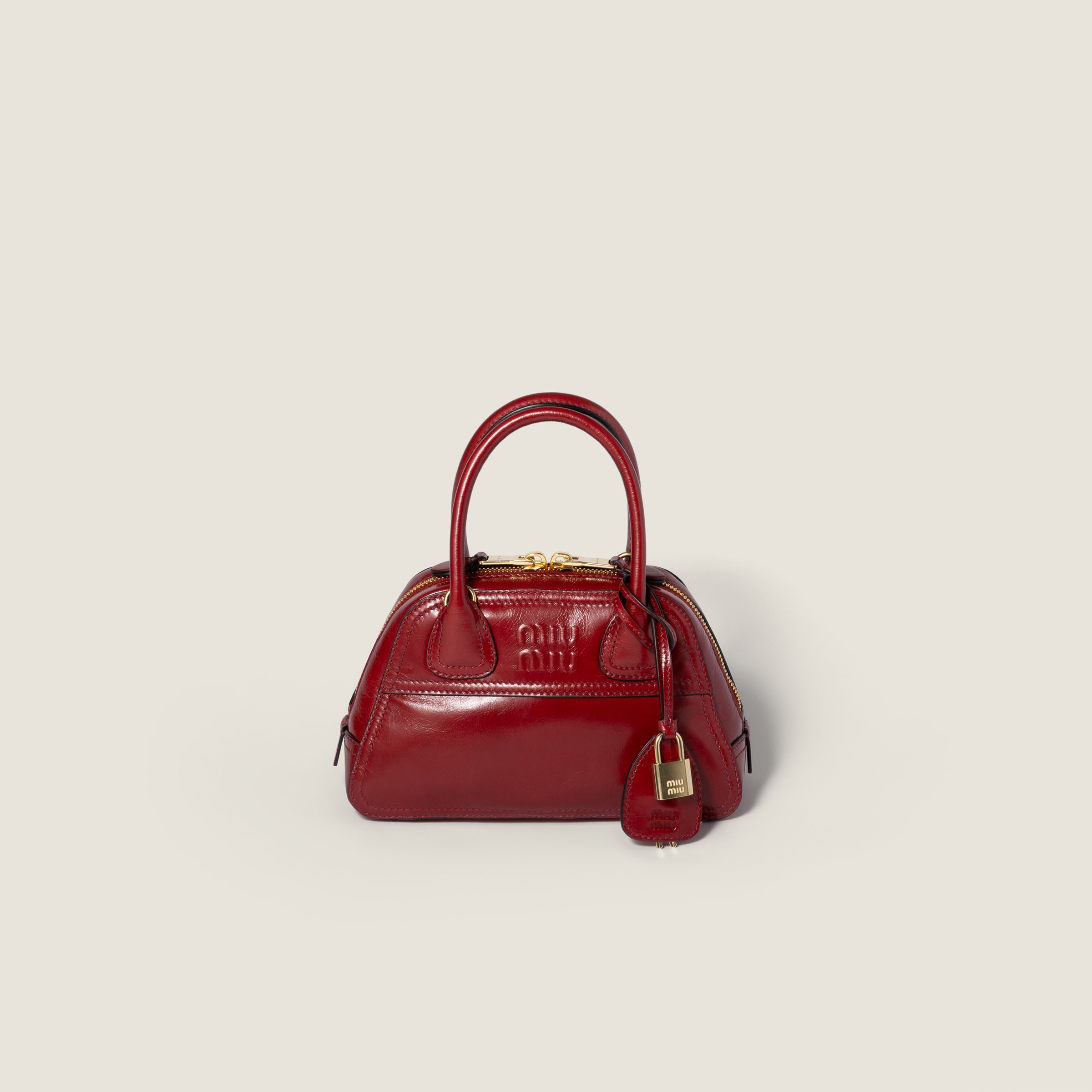 Vivant shiny leather mini-bag by Miu Miu