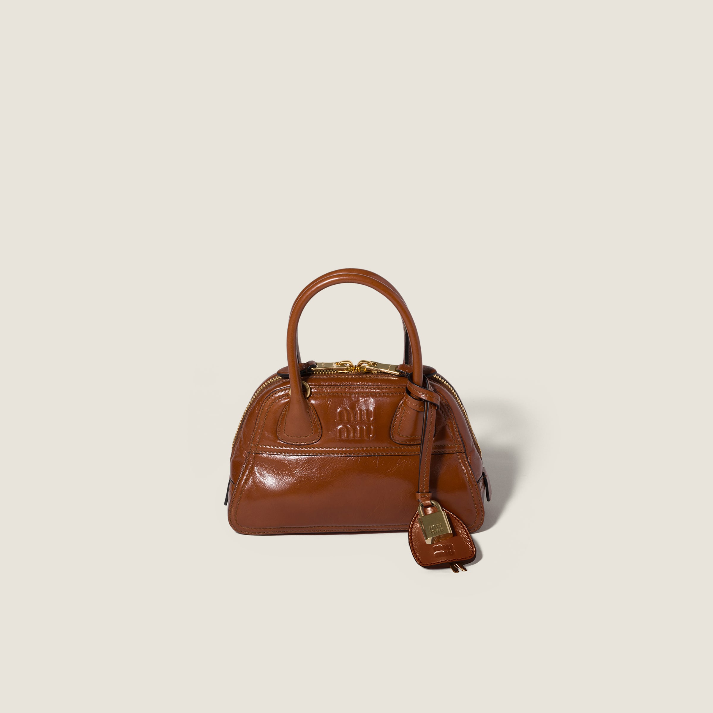 Vivant shiny leather mini-bag by Miu Miu