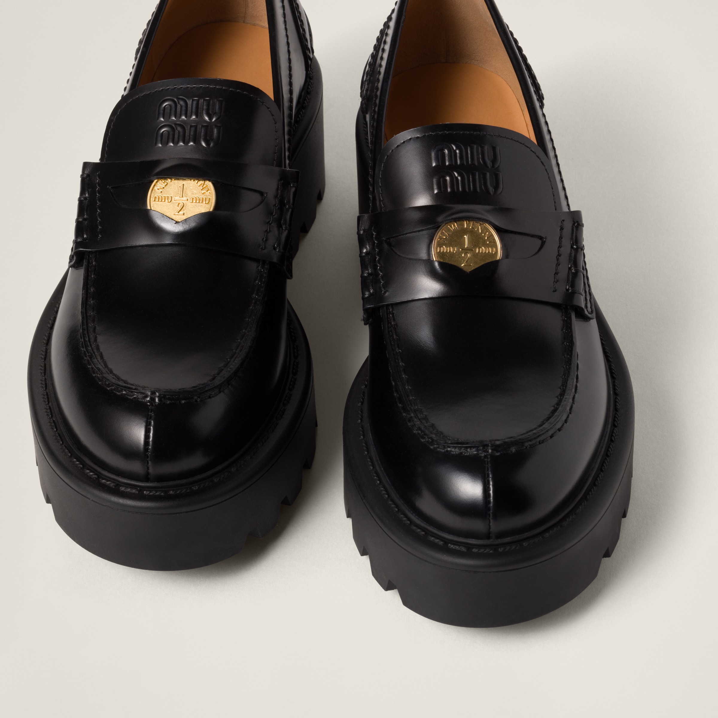 Black Brushed Leather Loafers | Miu Miu