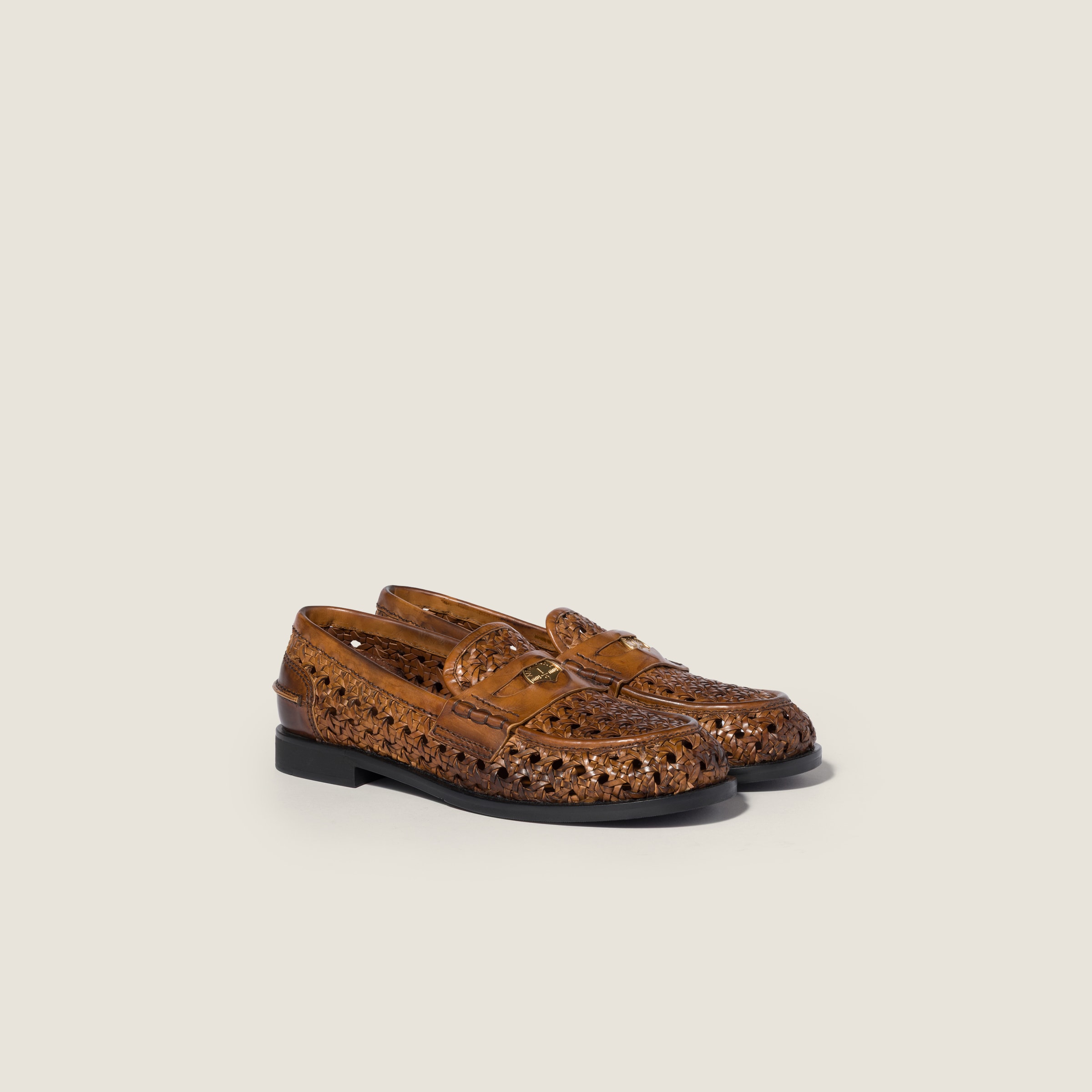 Woven leather loafers from Miu Miu - $1,820