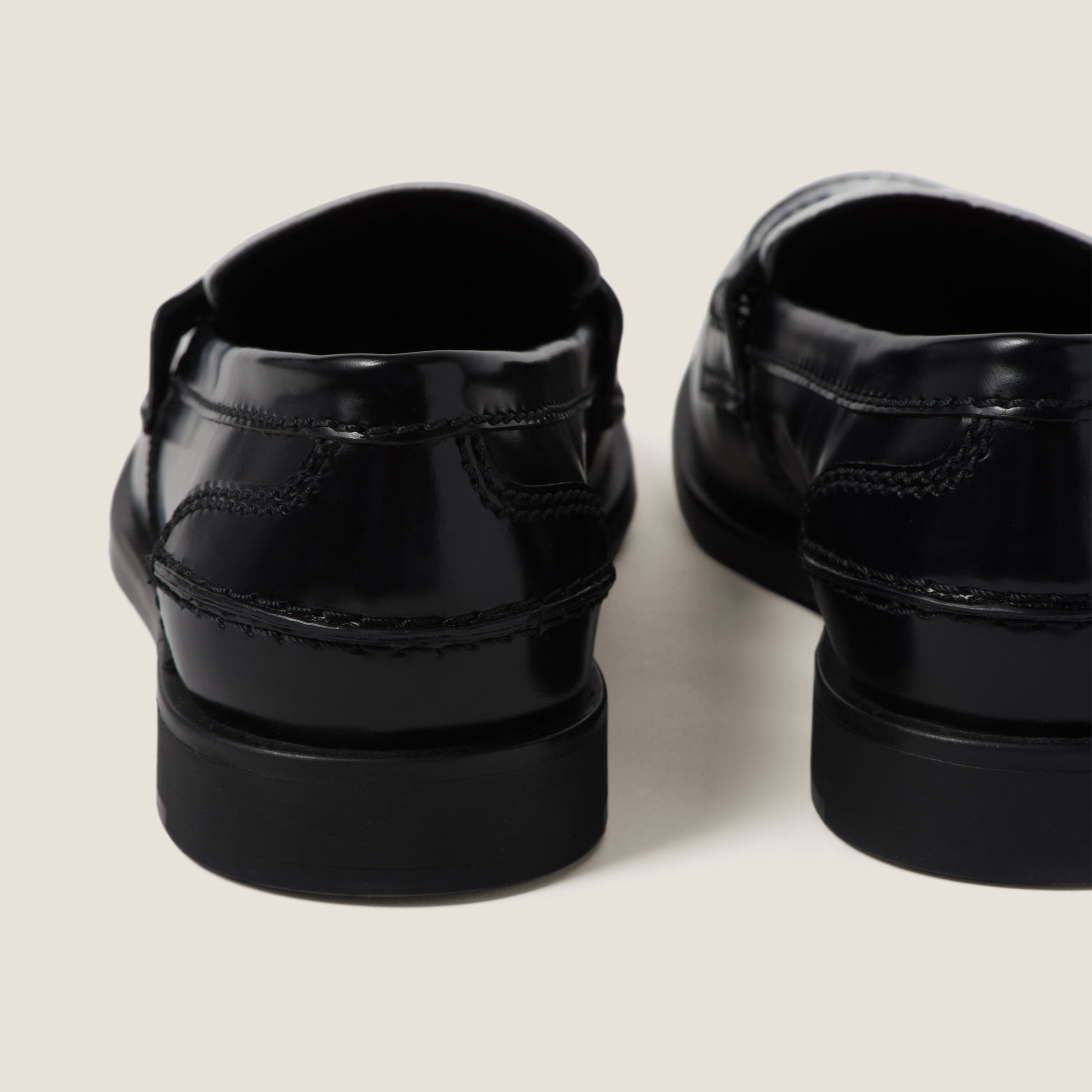 MIUMIU 26S FRINGE BUCKLE LOAFERS IN BLACK CALFSKIN