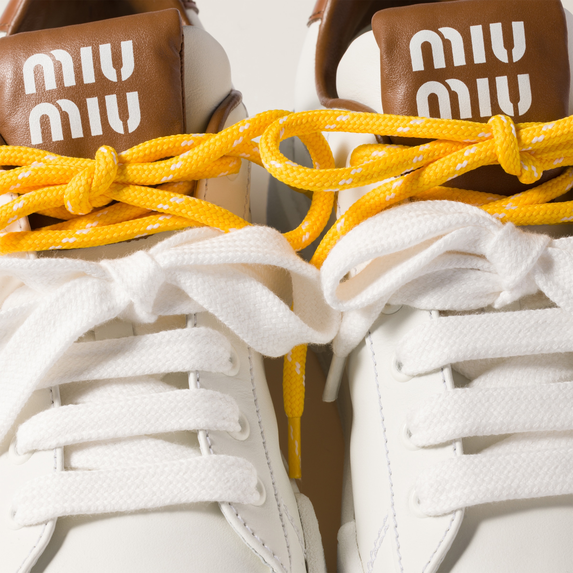 Miu Miu Leather Sneakers In White/cognac