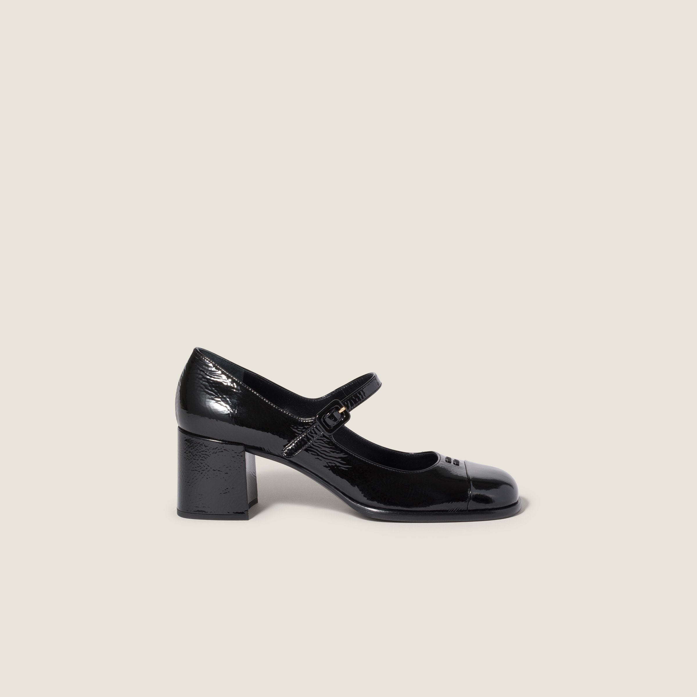 Patent leather and naplak leather pumps by Miu Miu