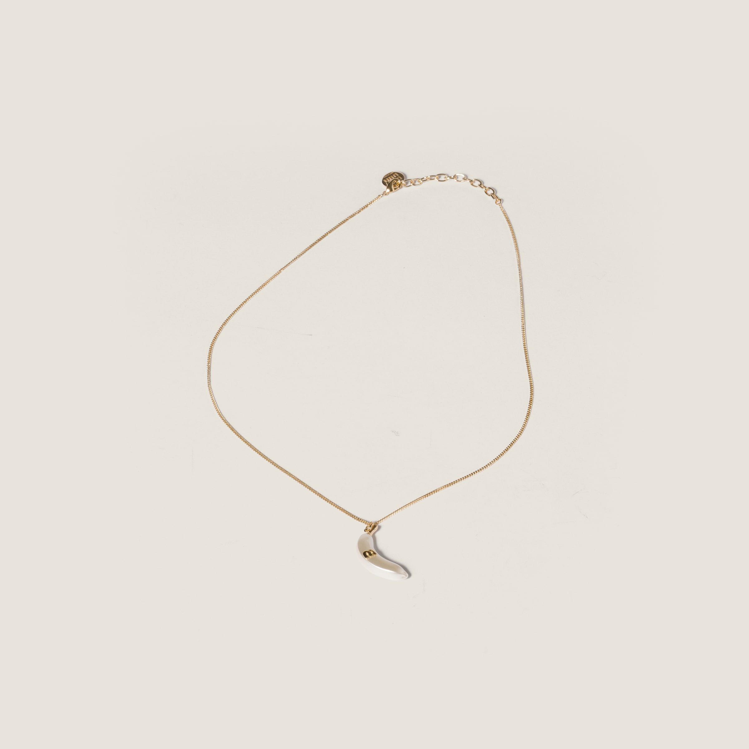 Metal necklace with pendant from Miu Miu - $650