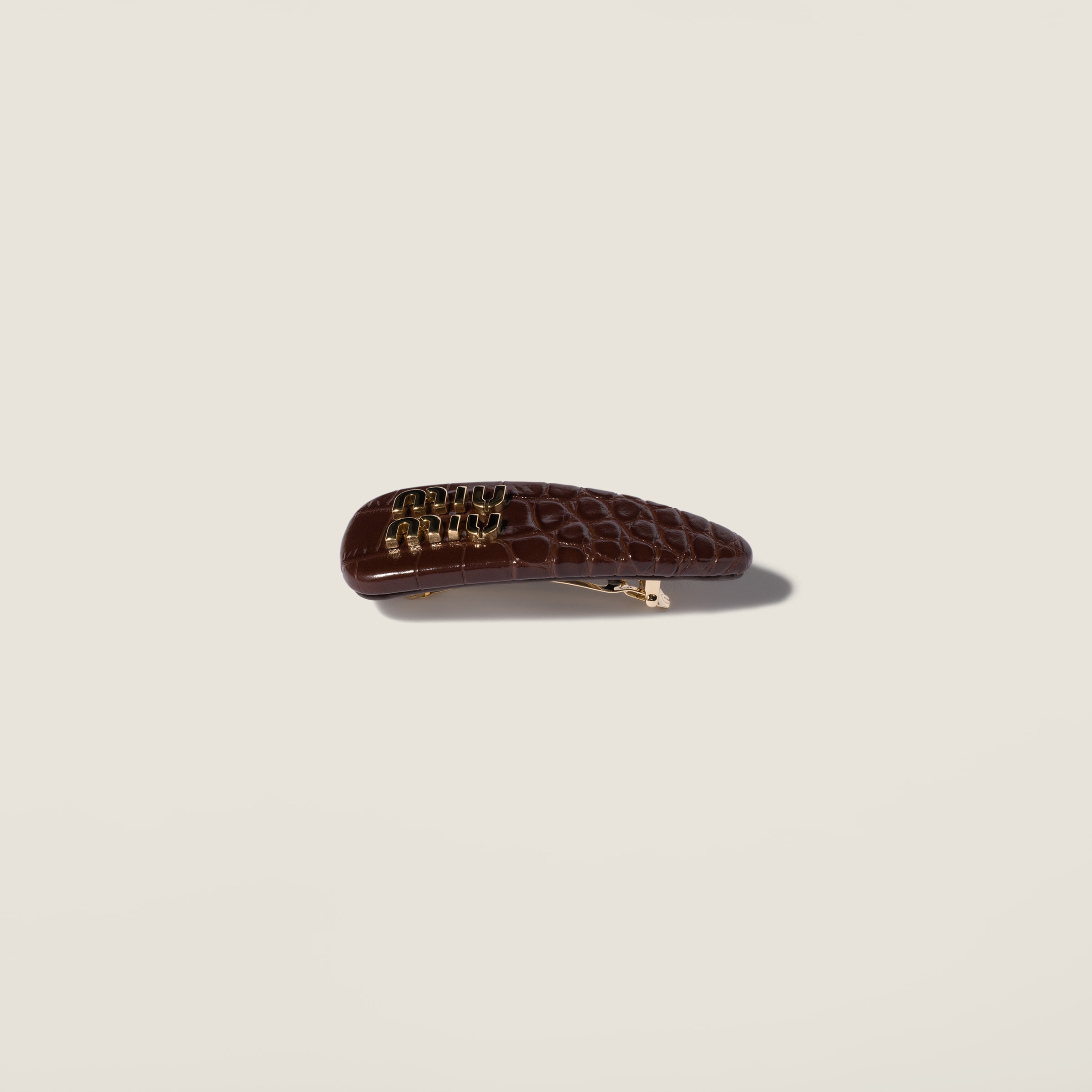 Crocodile embossed calfskin hair clip by Miu Miu