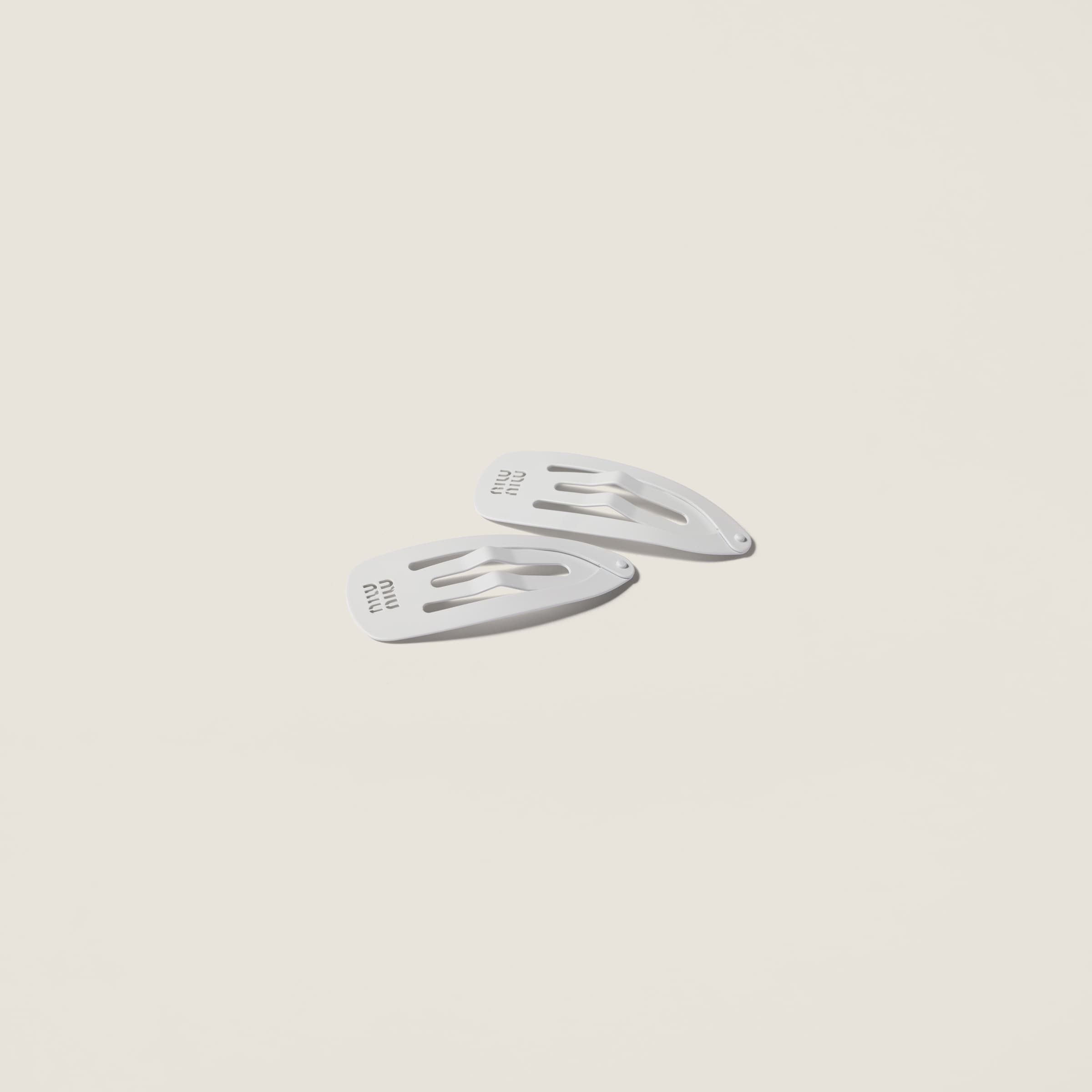 Metal hair clips from Miu Miu - $380