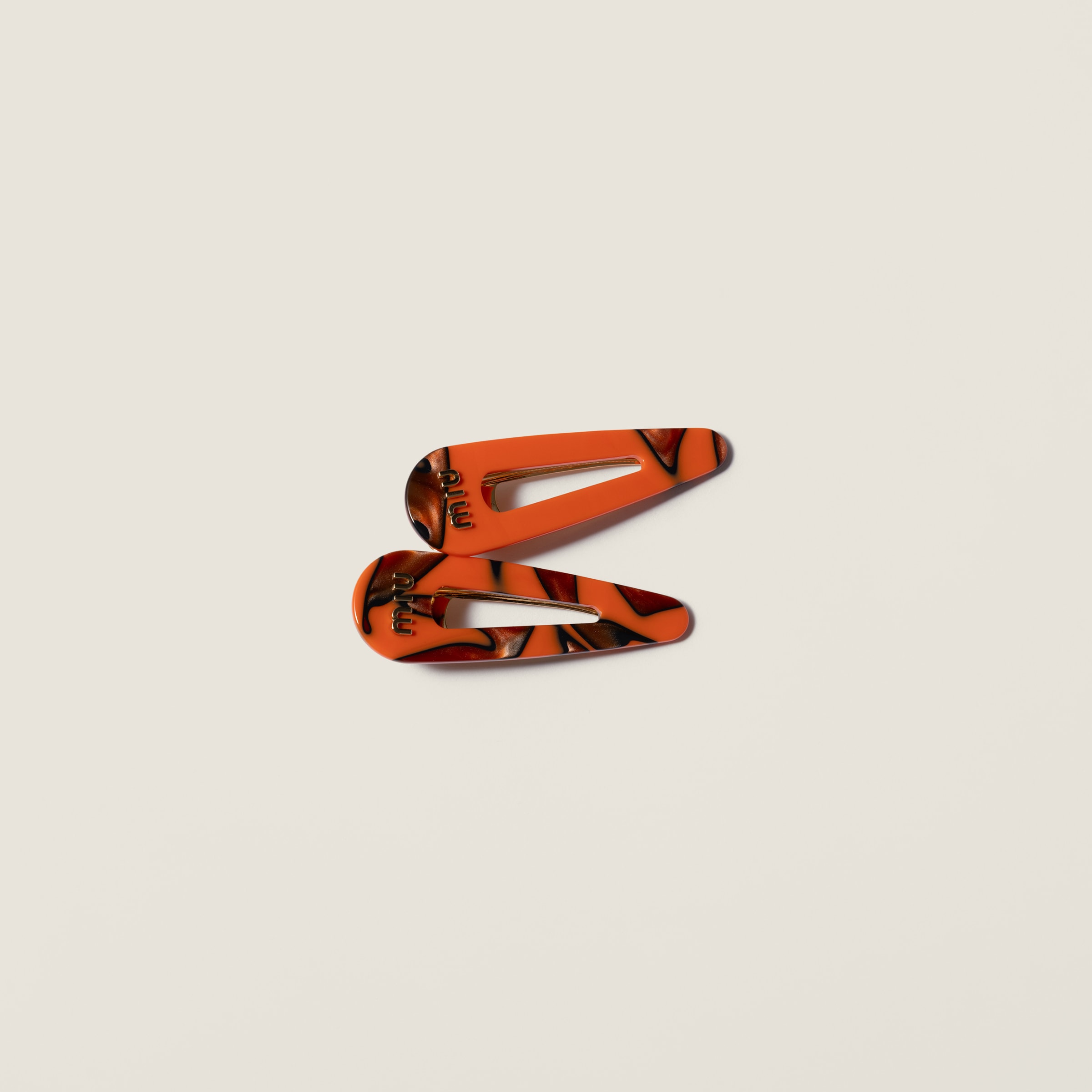 Hair clips with logo by Miu Miu