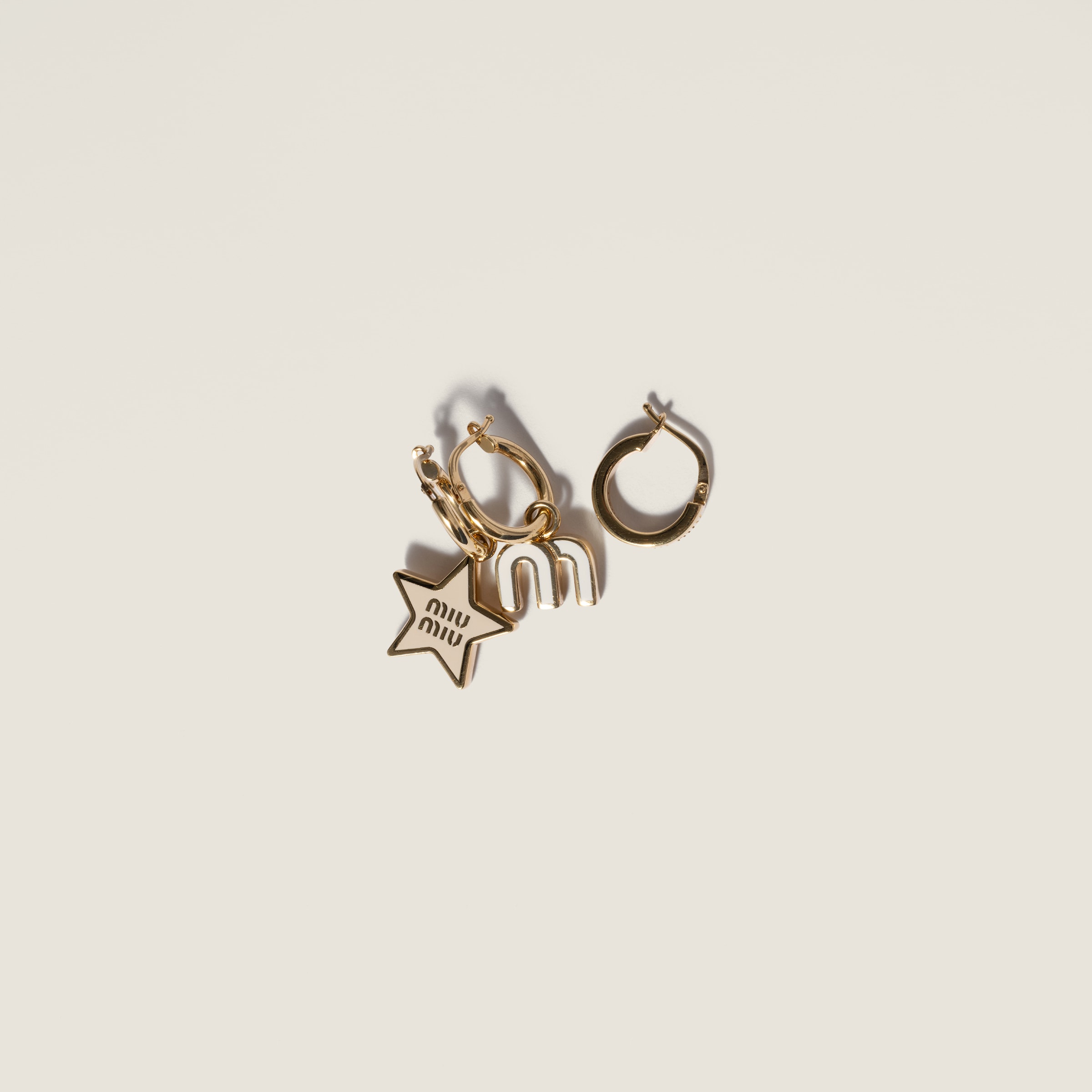 Set of enameled metal earrings by Miu Miu