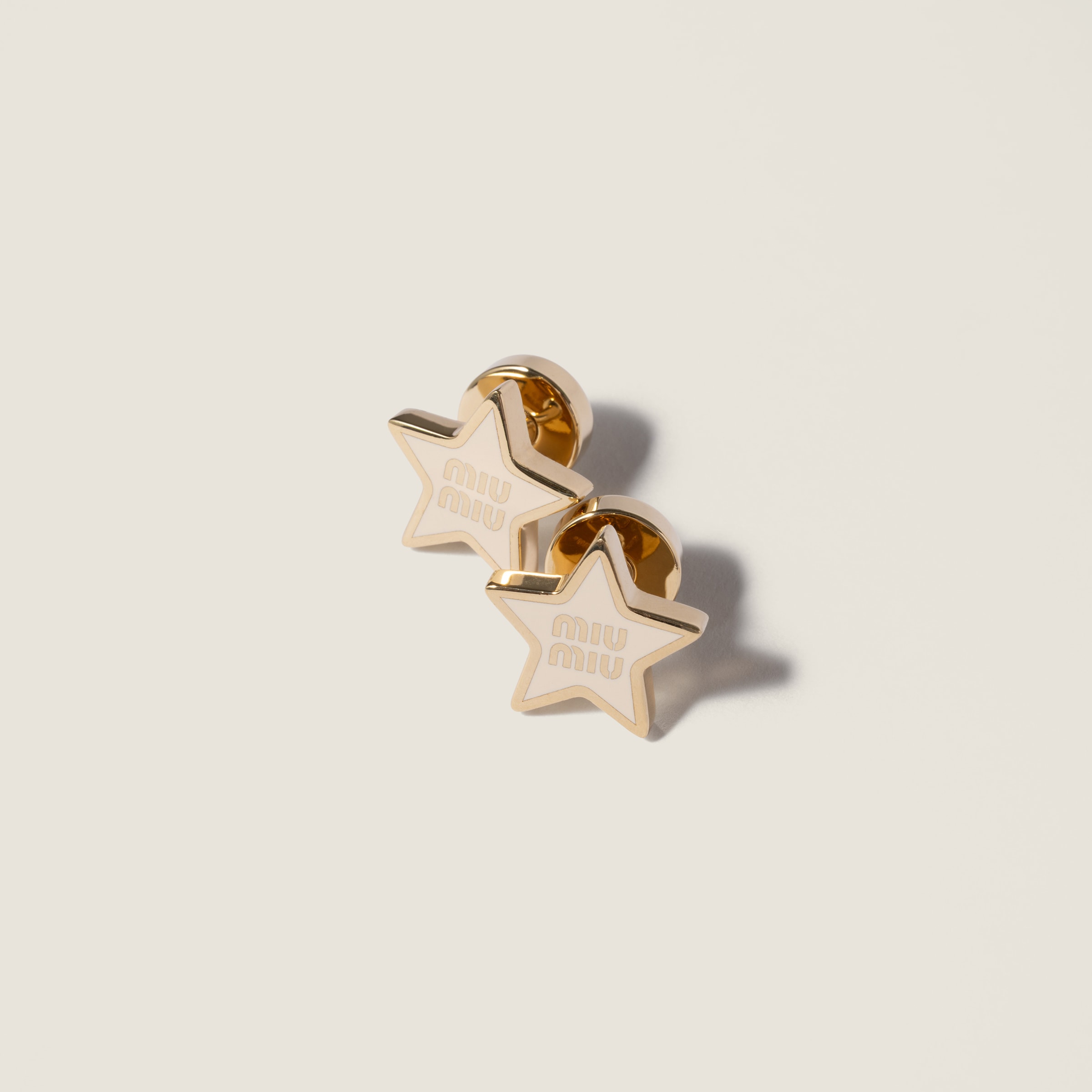 Enameled metal earrings by Miu Miu