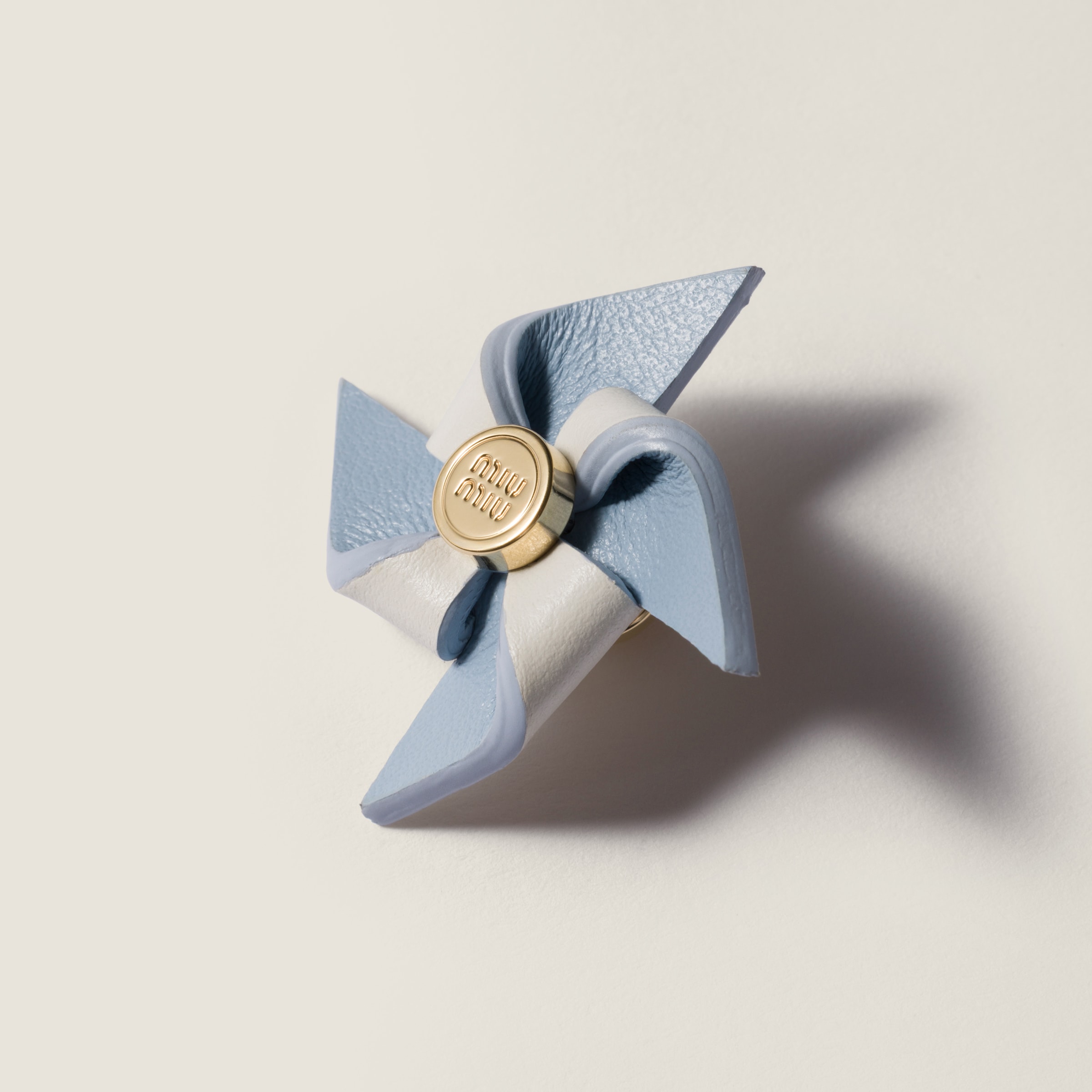 Miu Miu Leather Pinwheel Brooch In Blue