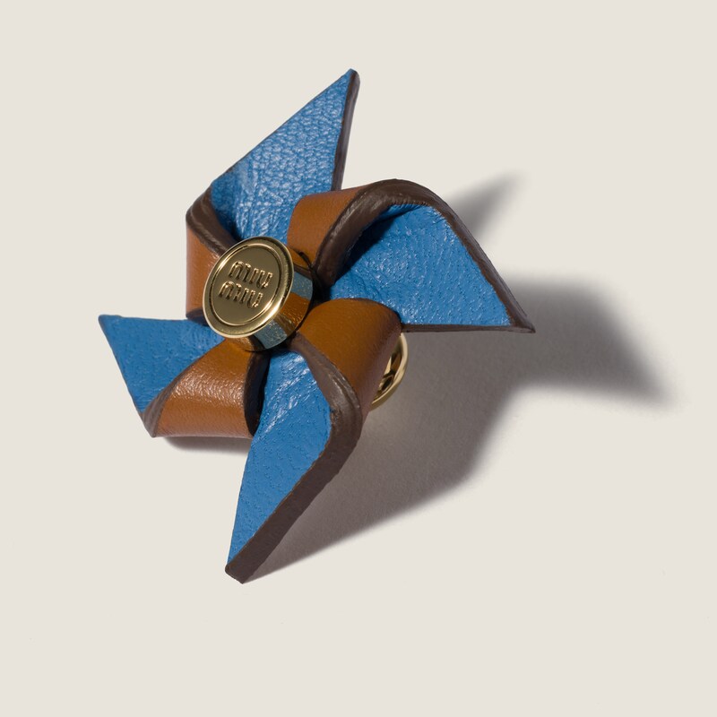 Leather pinwheel brooch