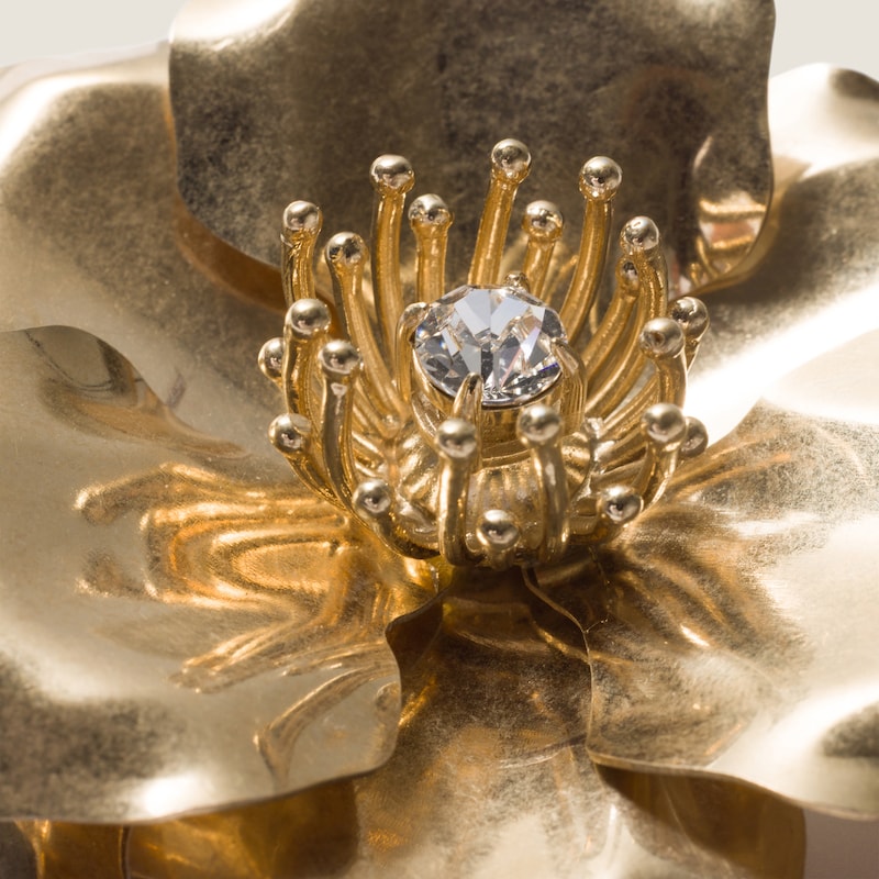 Metal brooch with crystal