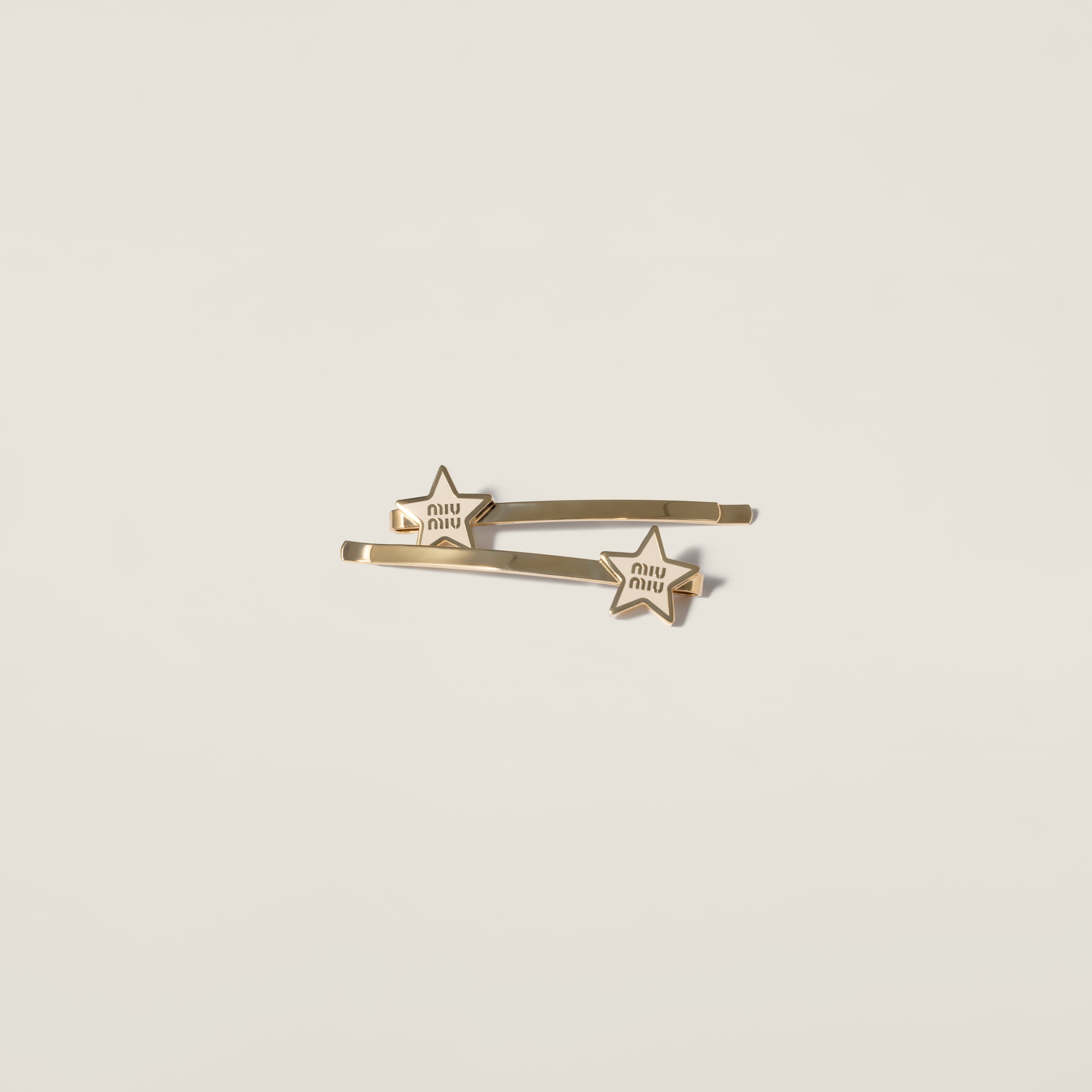 Enameled metal hair clip by Miu Miu