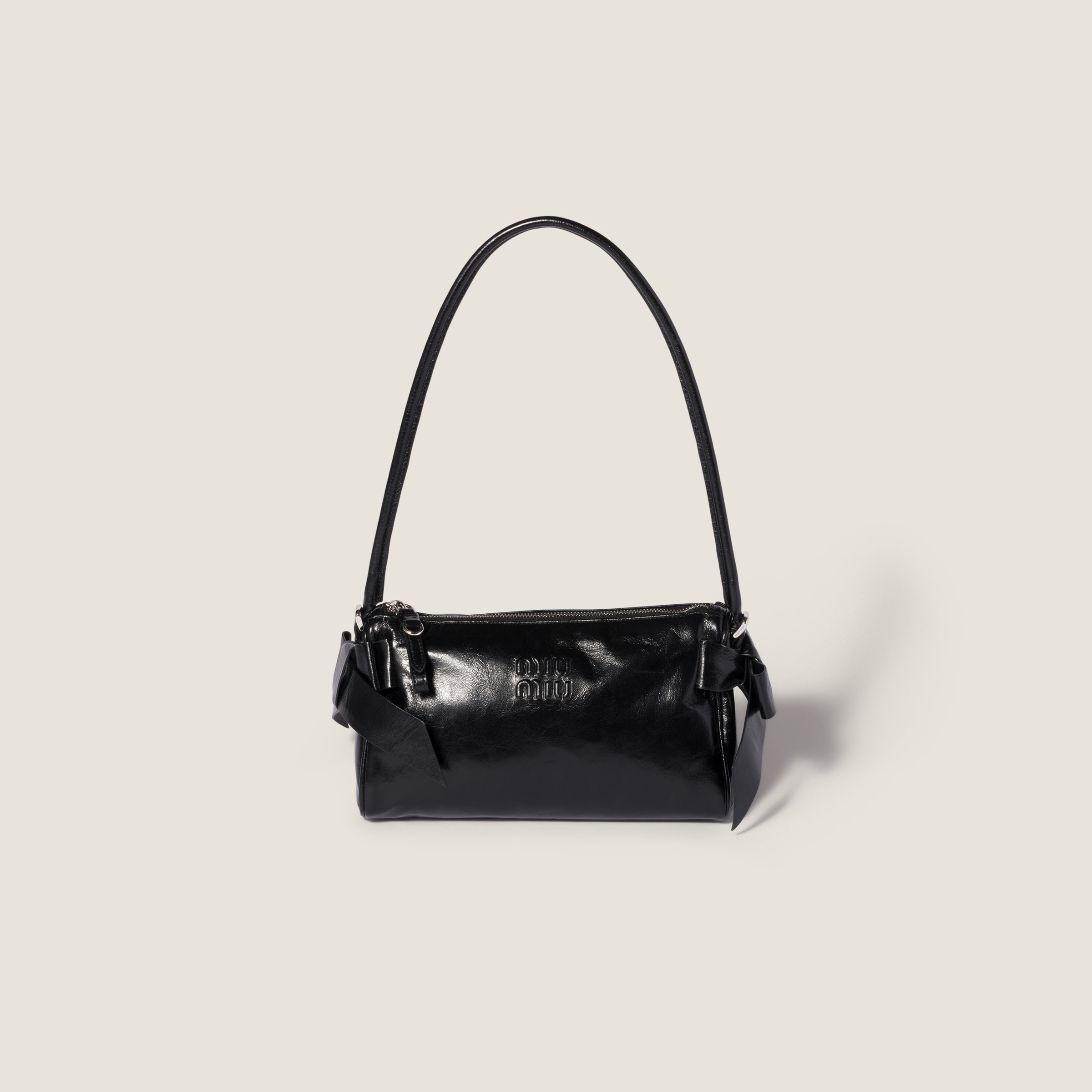 Shiny leather pouch from Miu Miu - $1,690