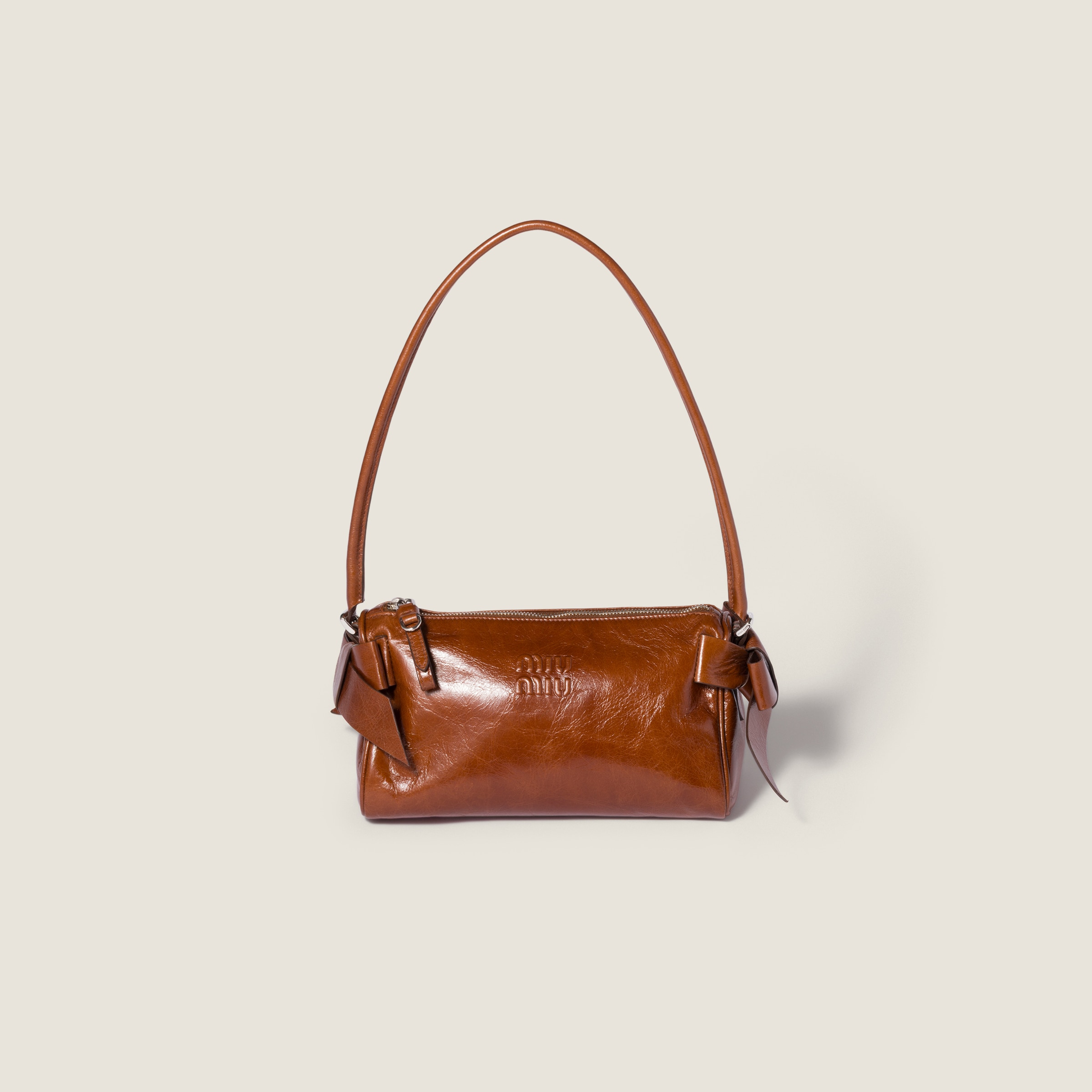 Shiny leather pouch from Miu Miu - $1,690