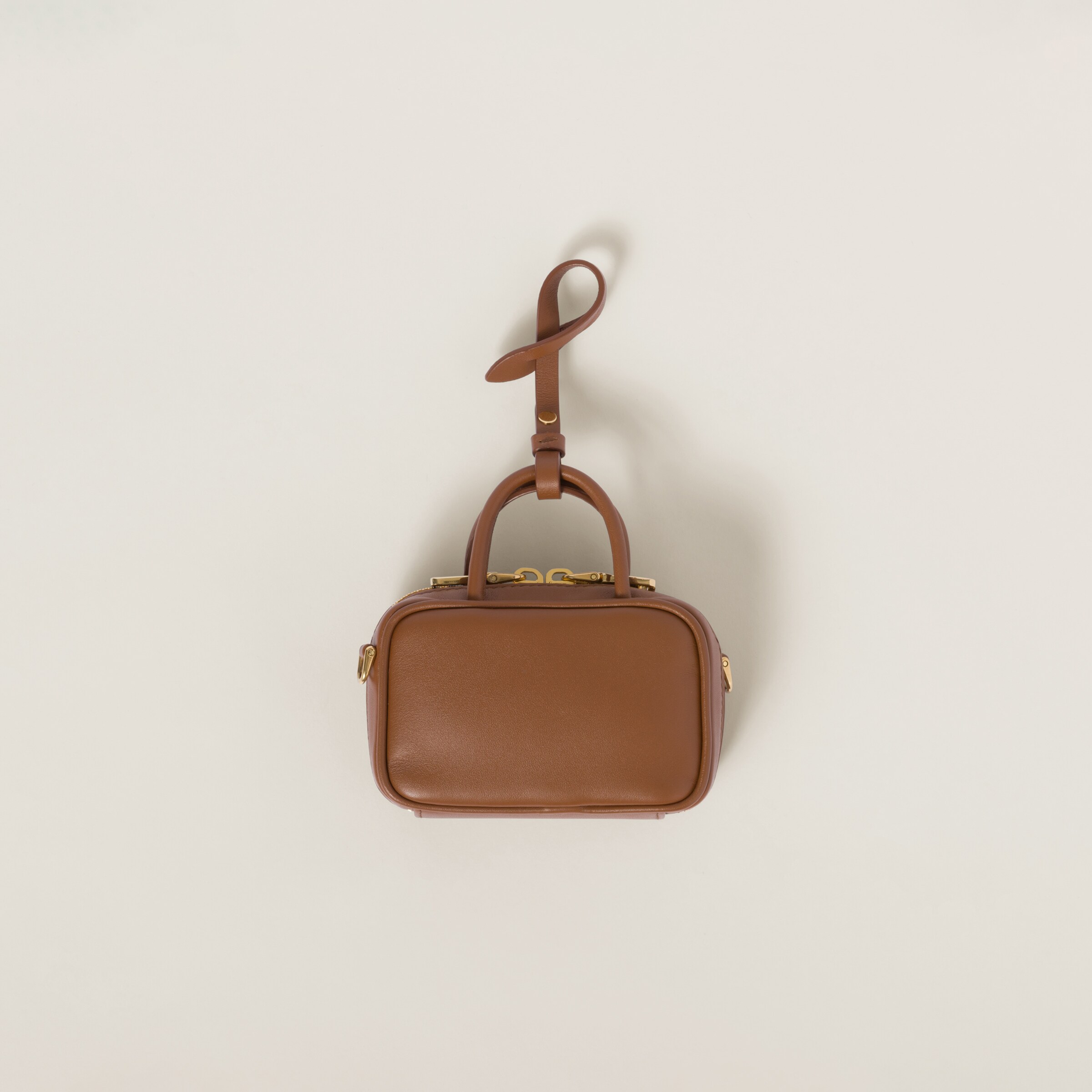 Shop Miumiu Leather Micro Bag In Cognac