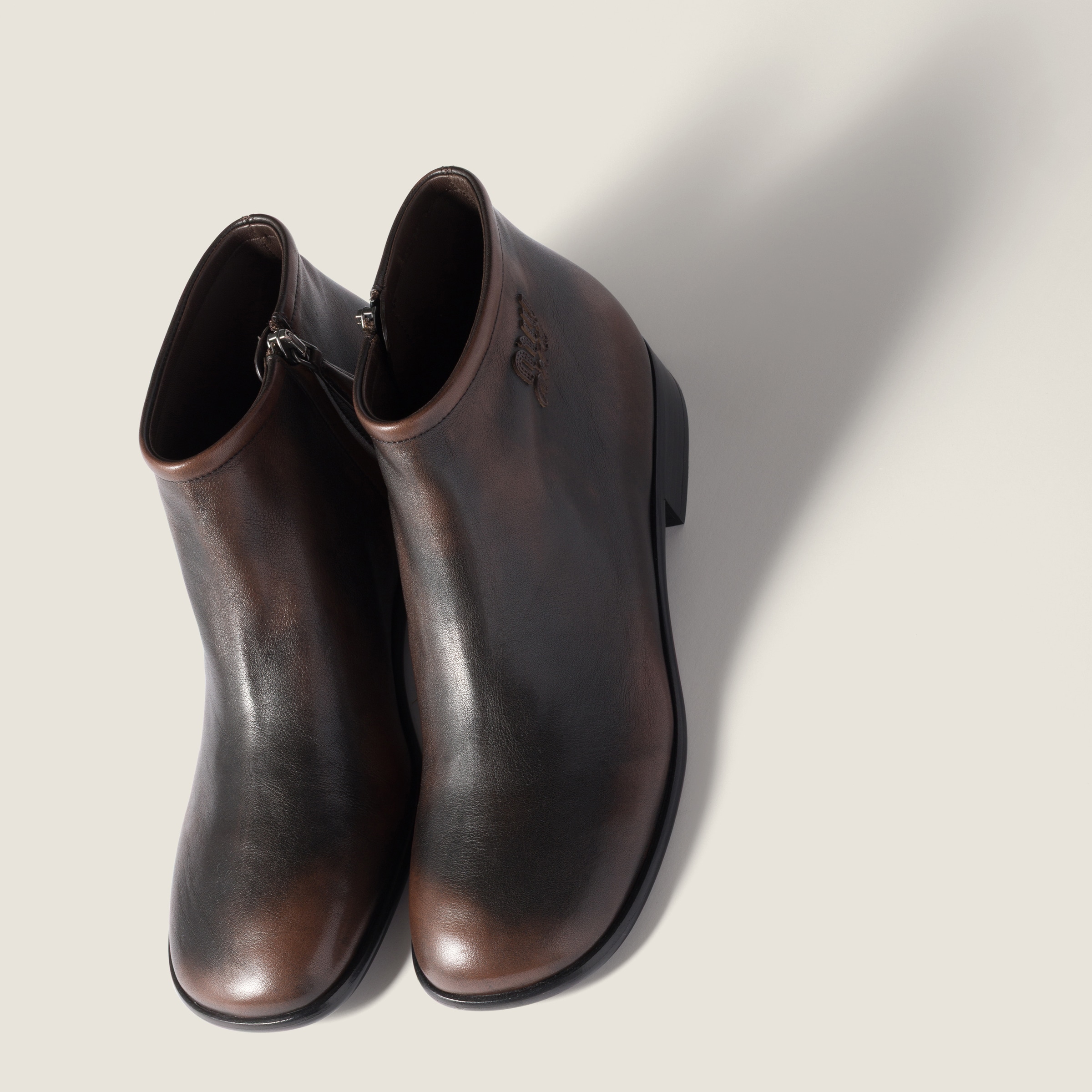 Miu Miu Fumé Leather Booties In Animal Print