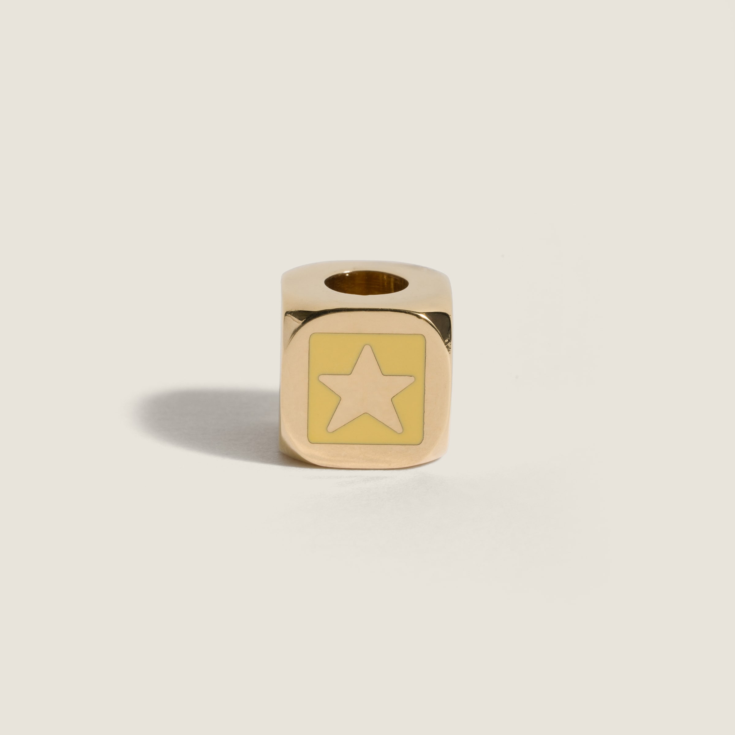 Enameled metal dice charm with star