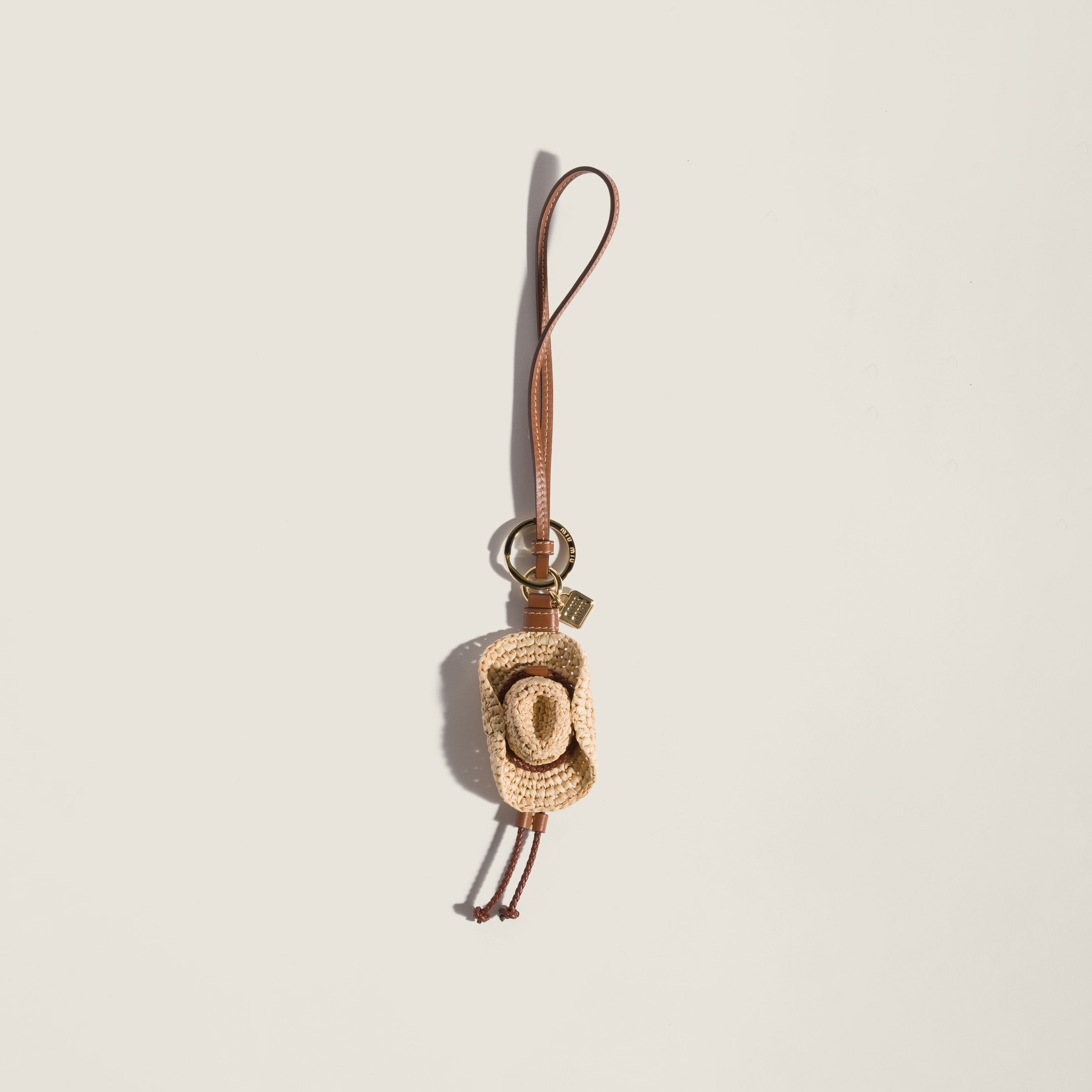 Raffia and leather key ring trick from Miu Miu - $575