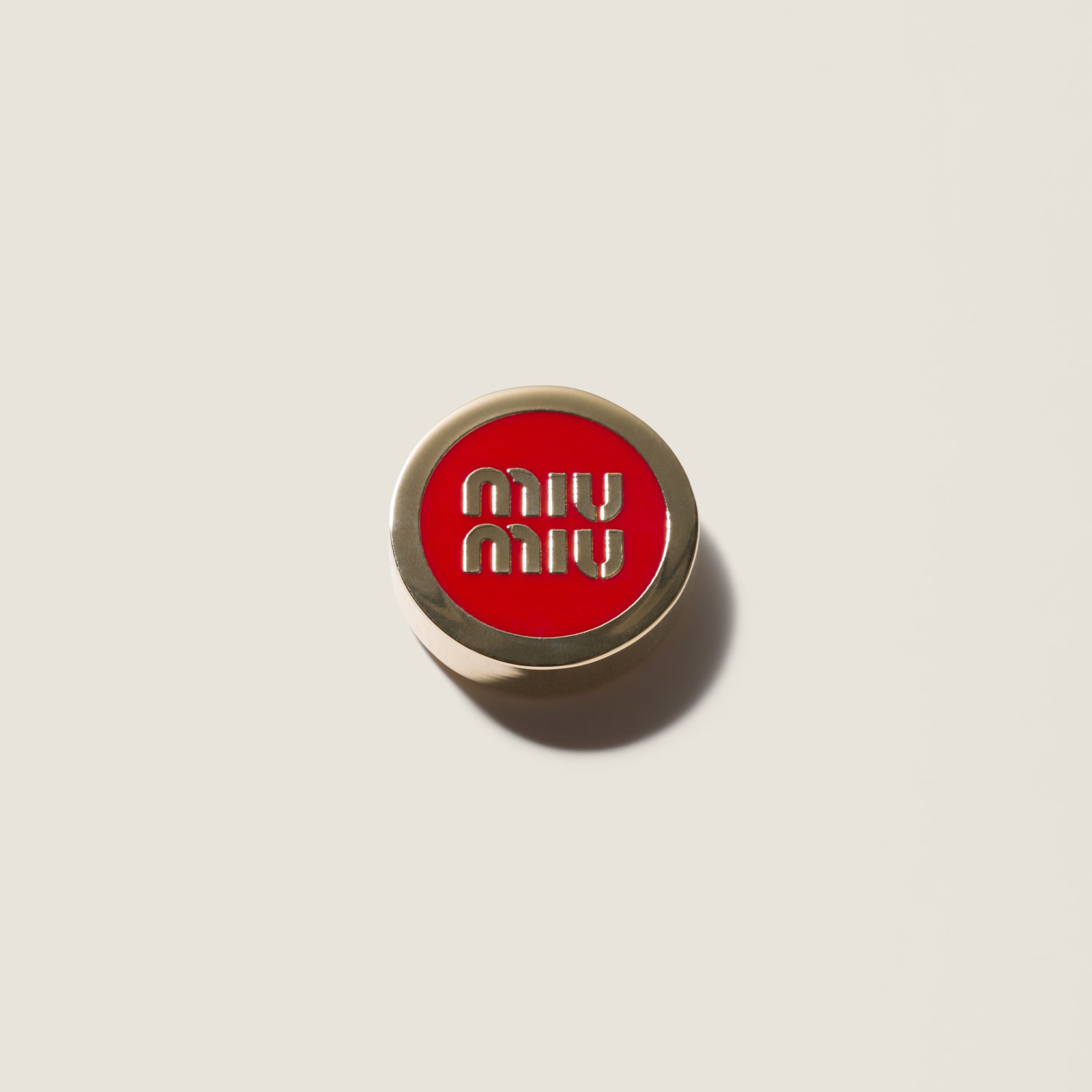 Enameled metal button cover from Miu Miu - $220
