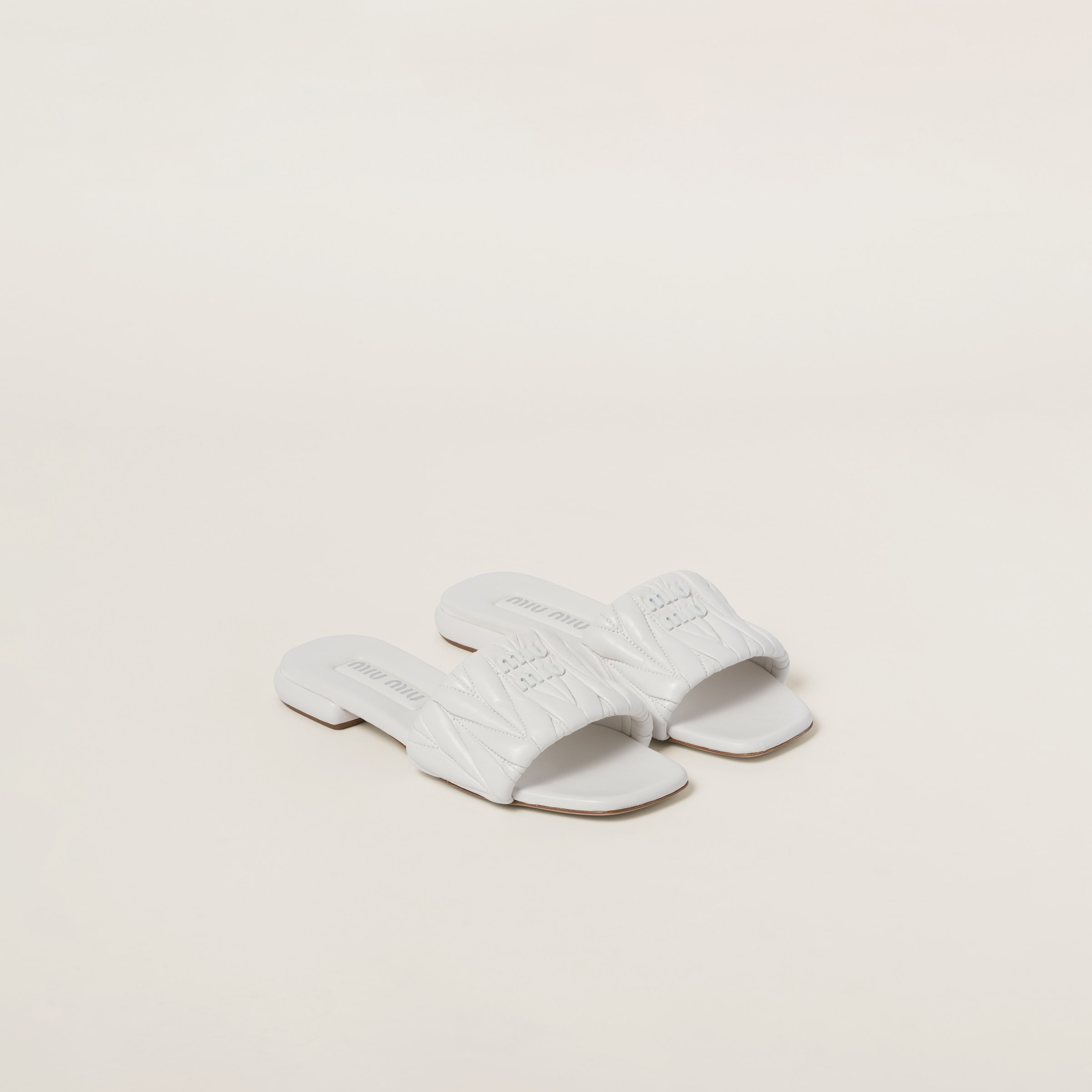 Sand Beige Matelassé Nappa Leather Slides | Miu Miu