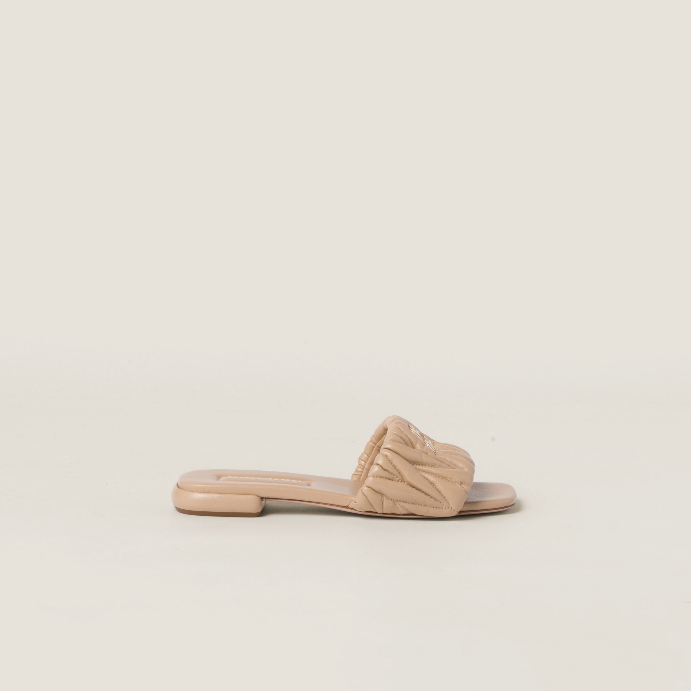 Sand Beige Matelassé Nappa Leather Slides | Miu Miu