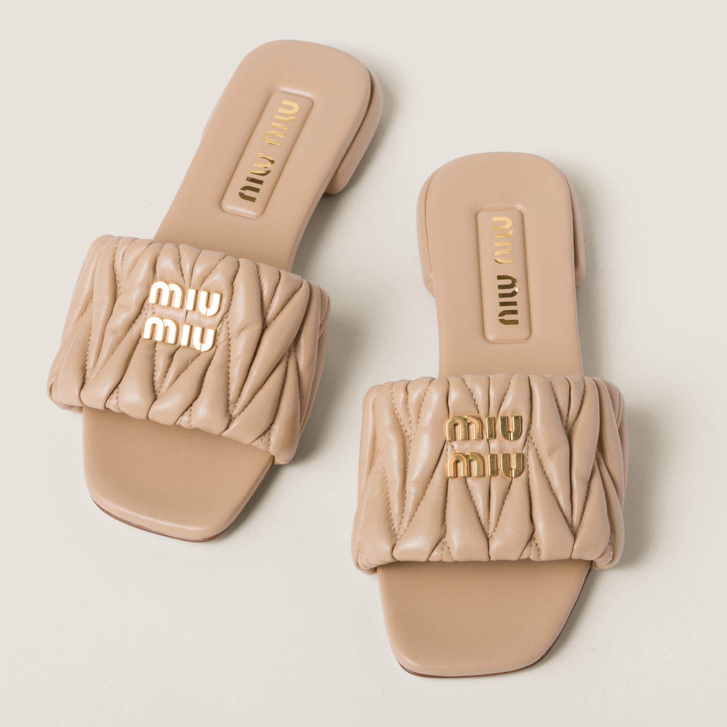 Shop Miumiu Matelassé Nappa Leather Slides In Sand Beige