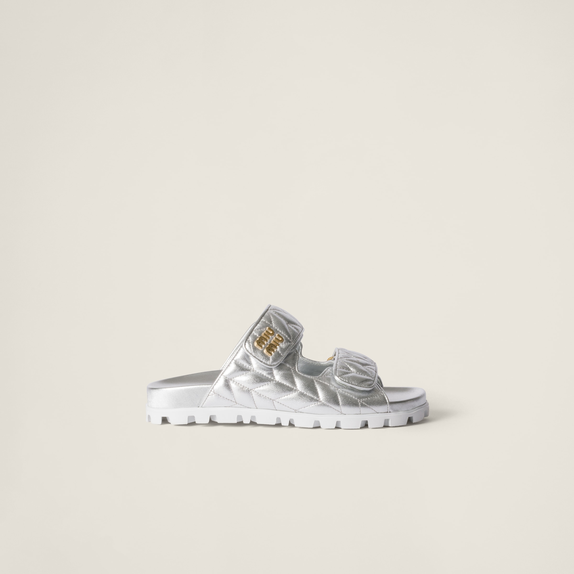 Silver Metallic Matelassé Nappa Leather Slides | Miu Miu