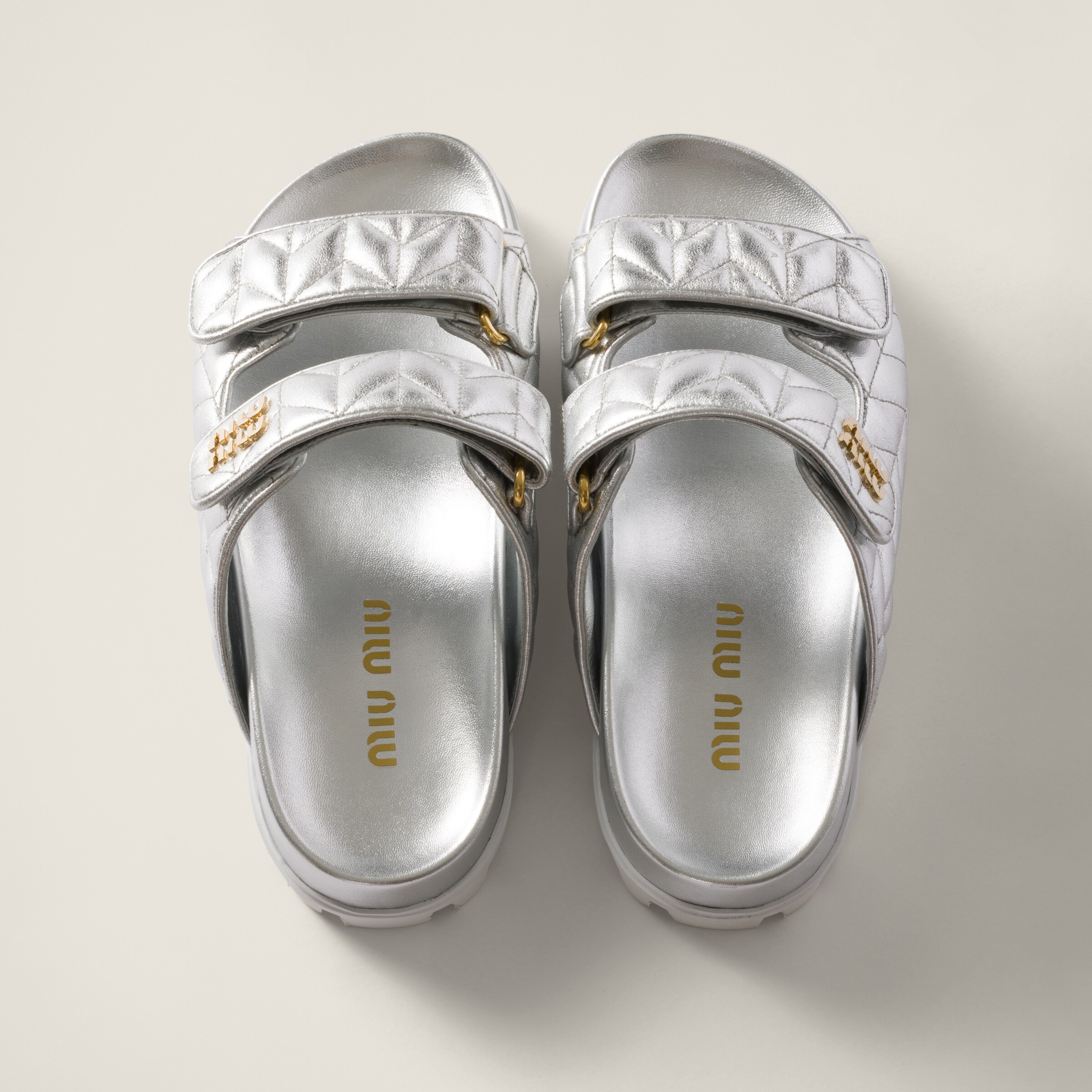 Silver Metallic Matelassé Nappa Leather Slides | Miu Miu